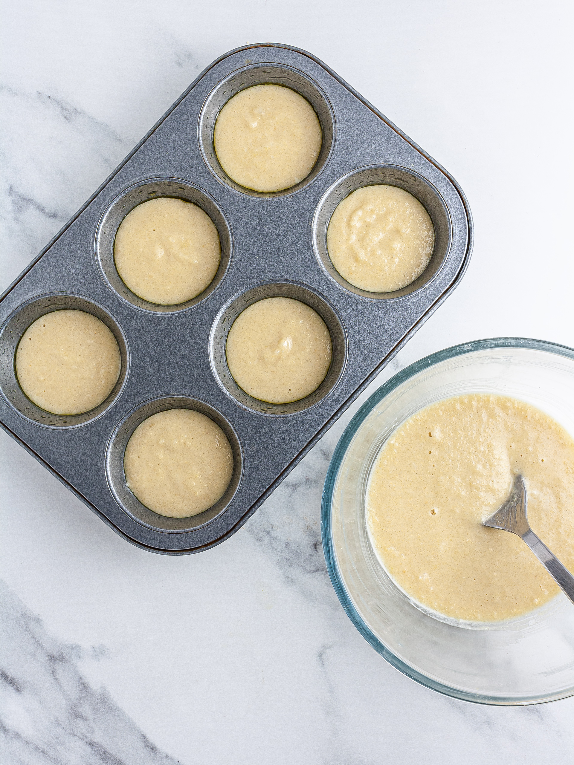 Jaffa cake batter poured in muffin tin