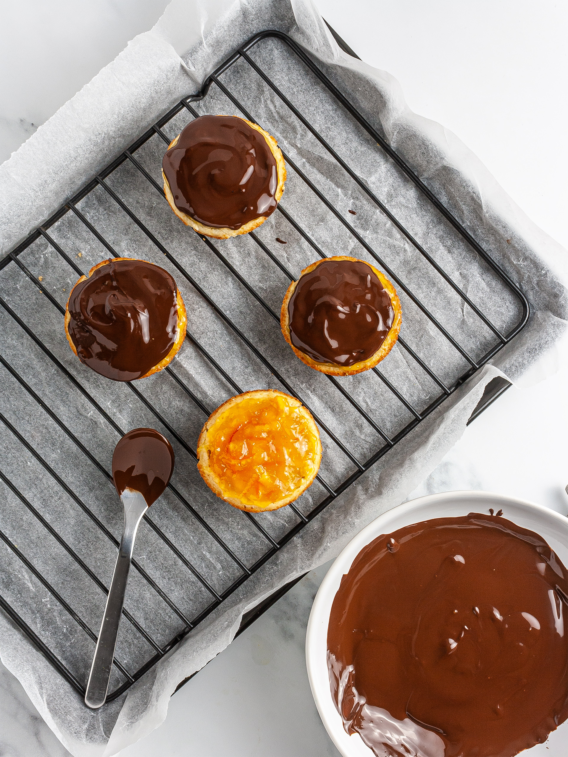 Melted dark chocolate poured over the jam 