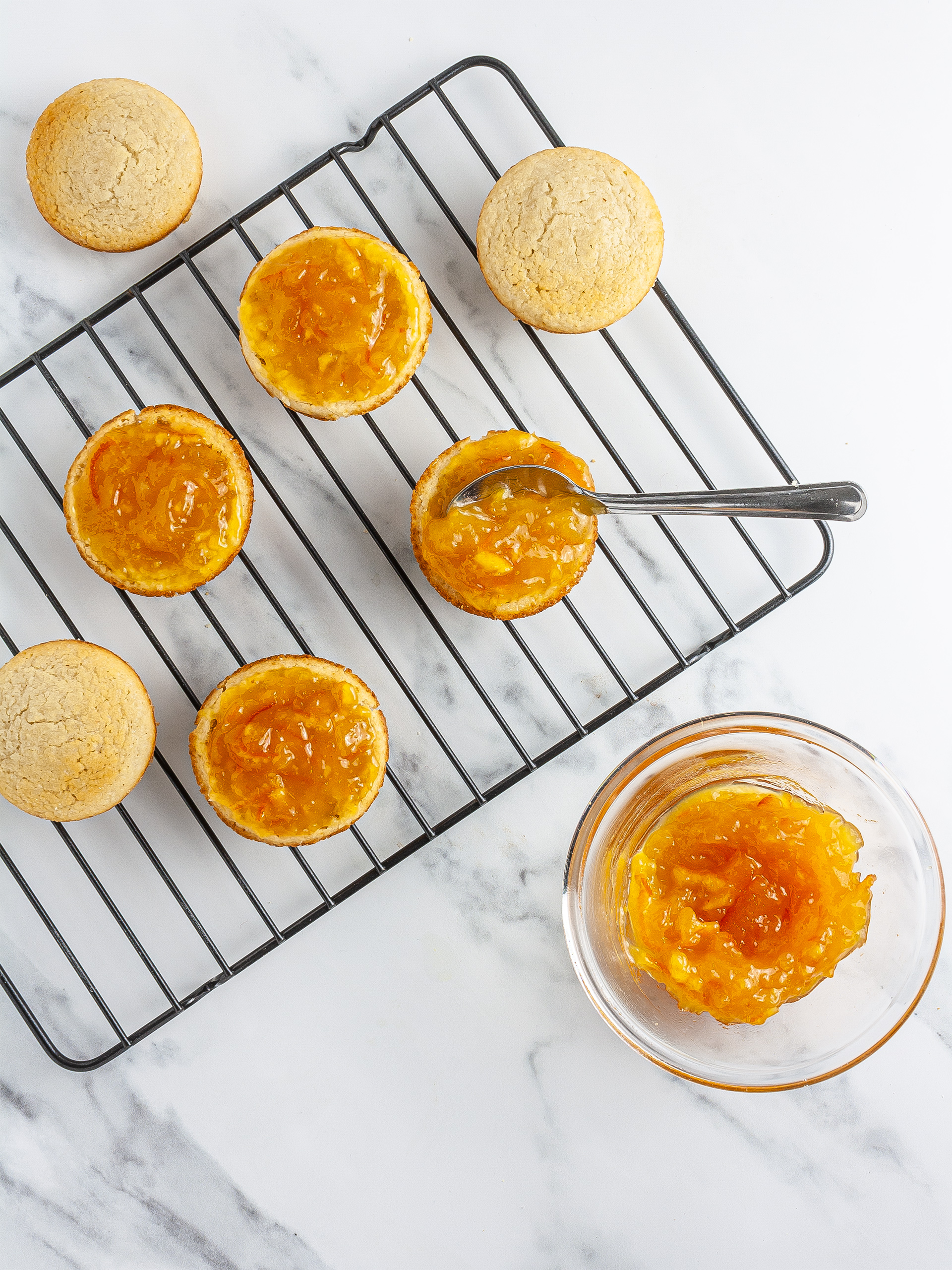 Orange jam spread over Jaffa cakes bases