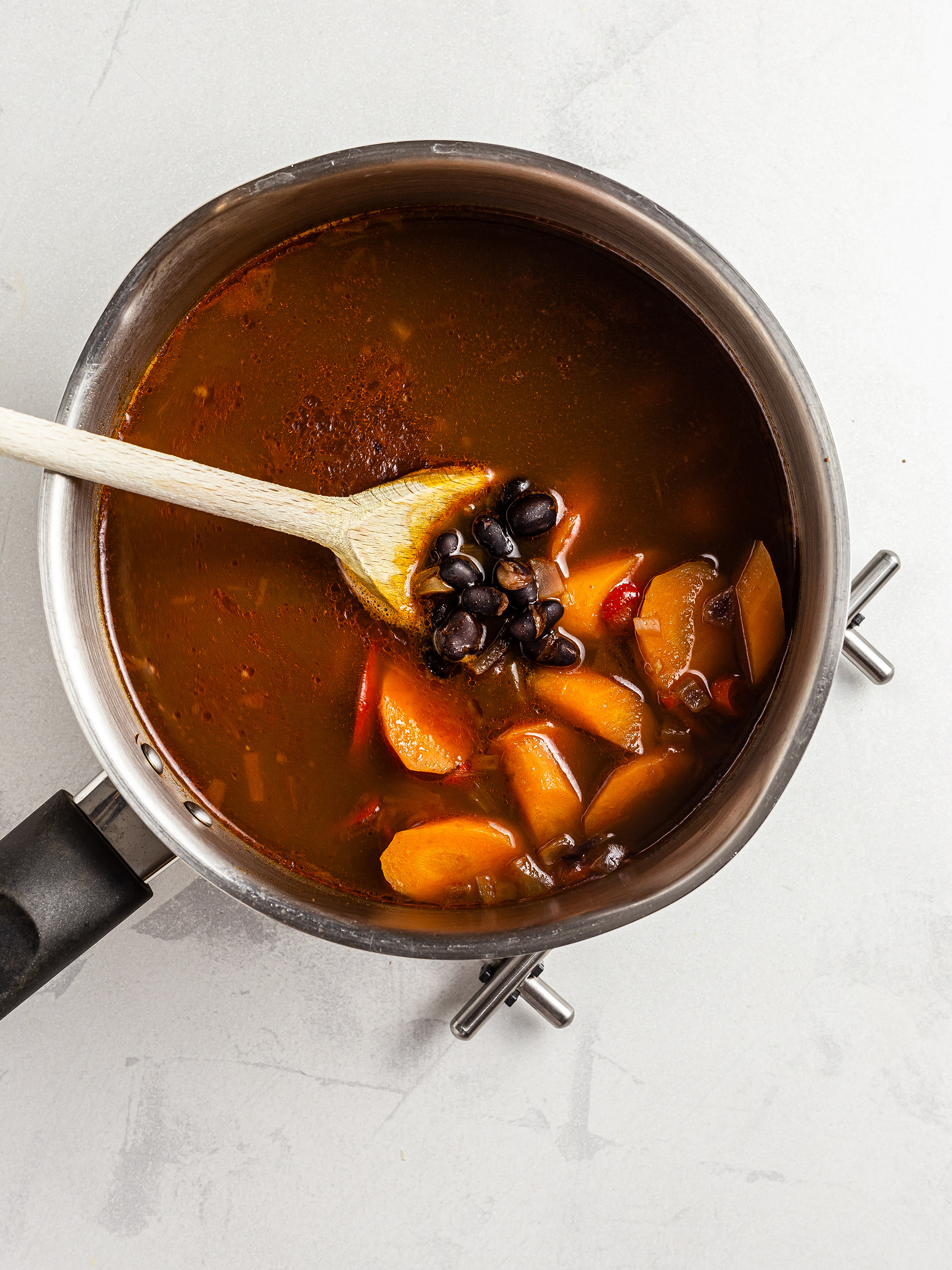 Black beans and carrot stew in a pot