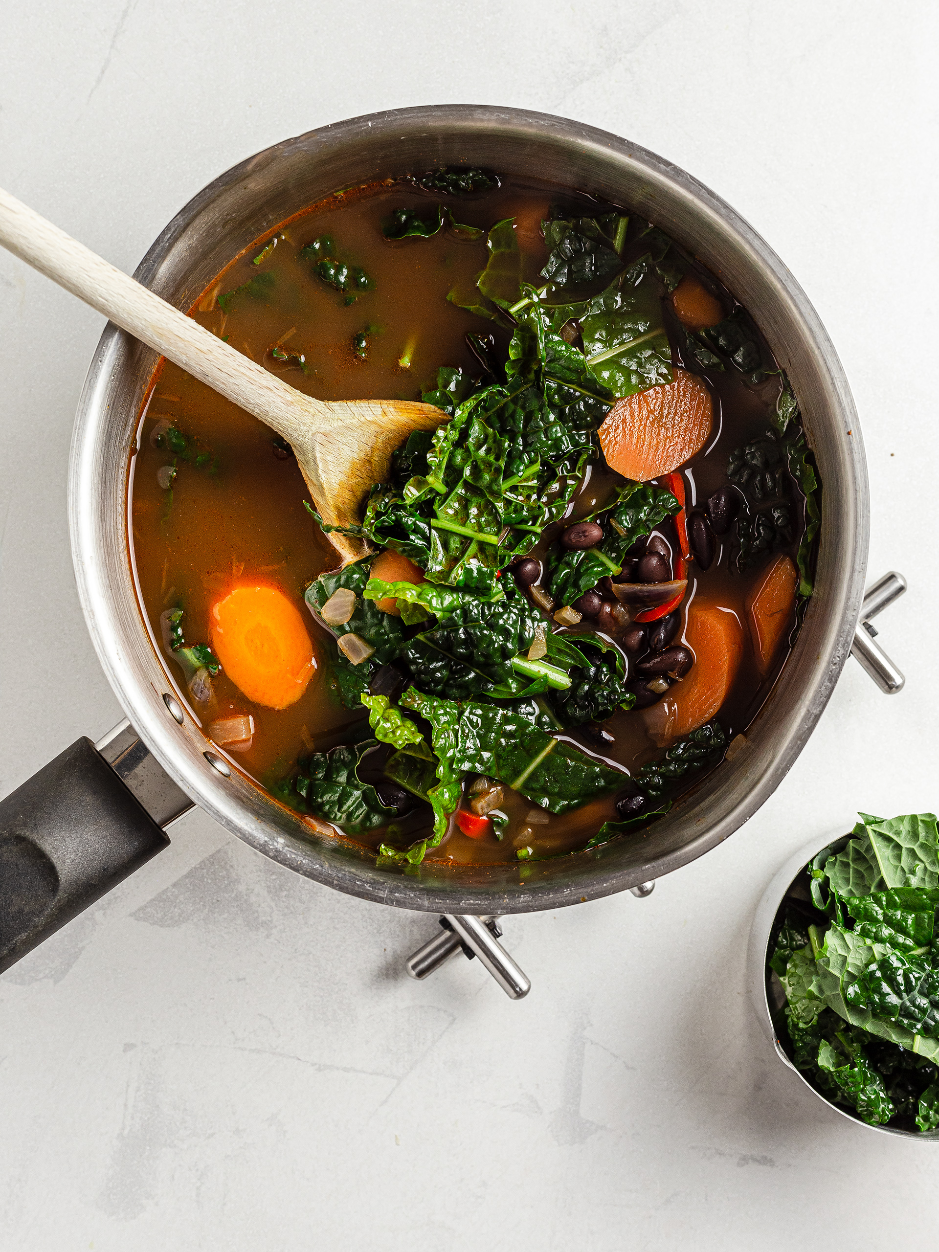 Black kale with carrot and black beans soup