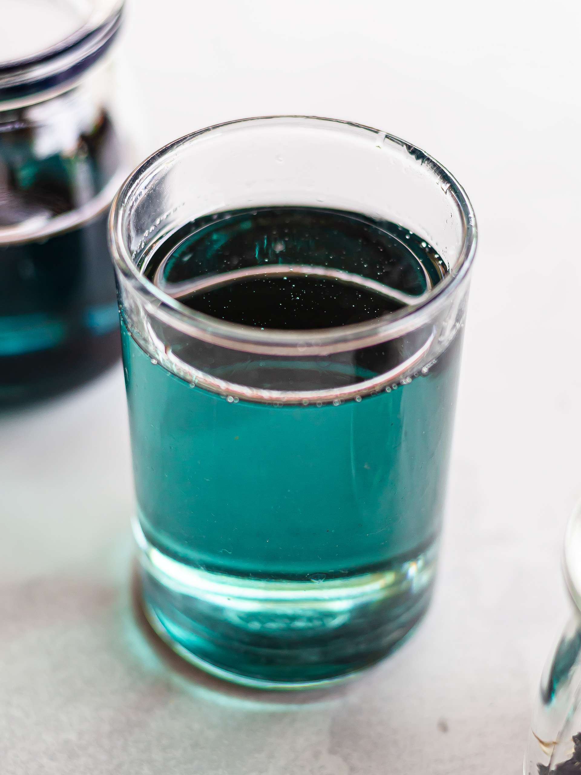 blue butterfly pea simple syrup in a glass