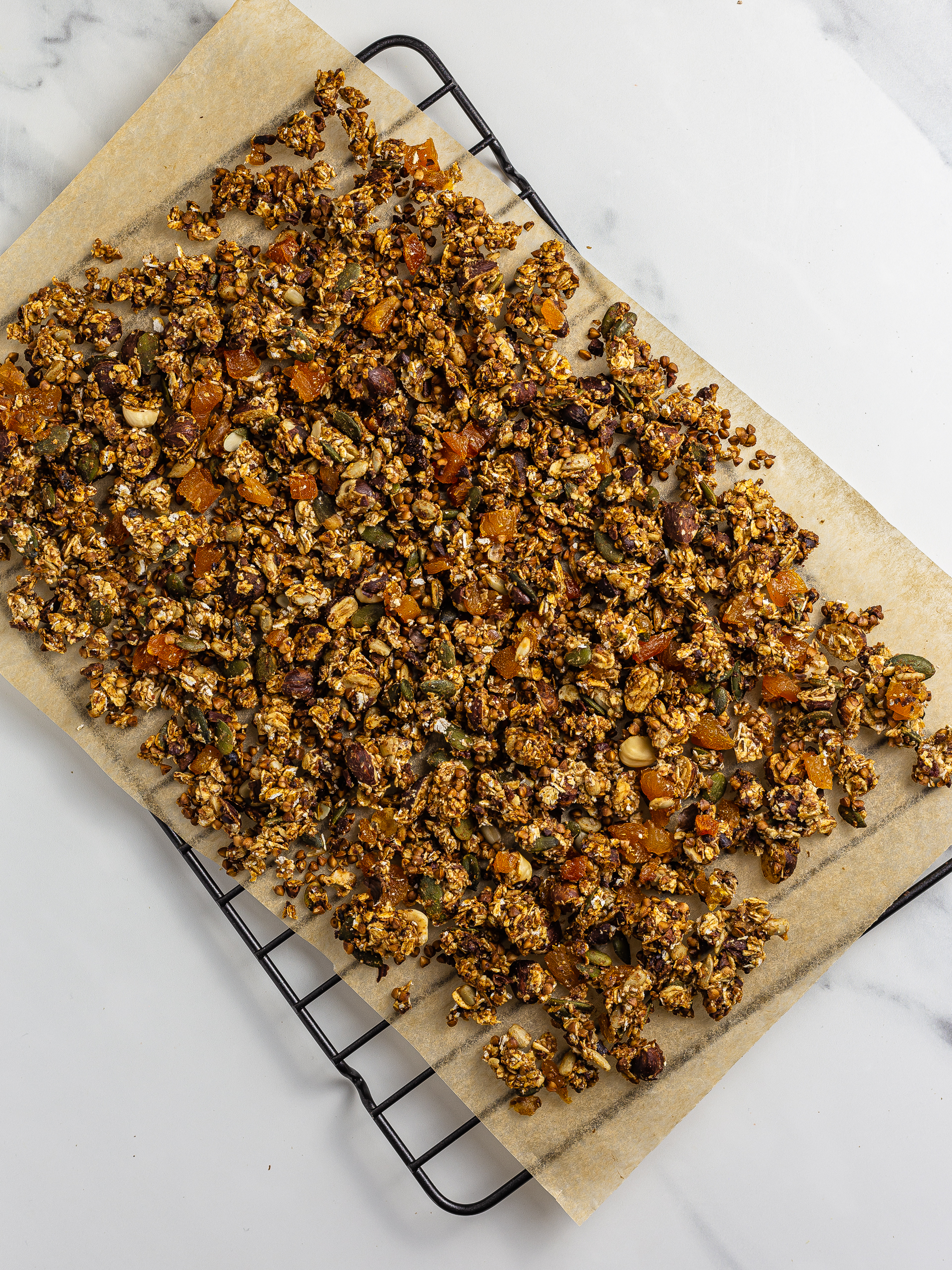 oven-baked granola cooling on a wire rack