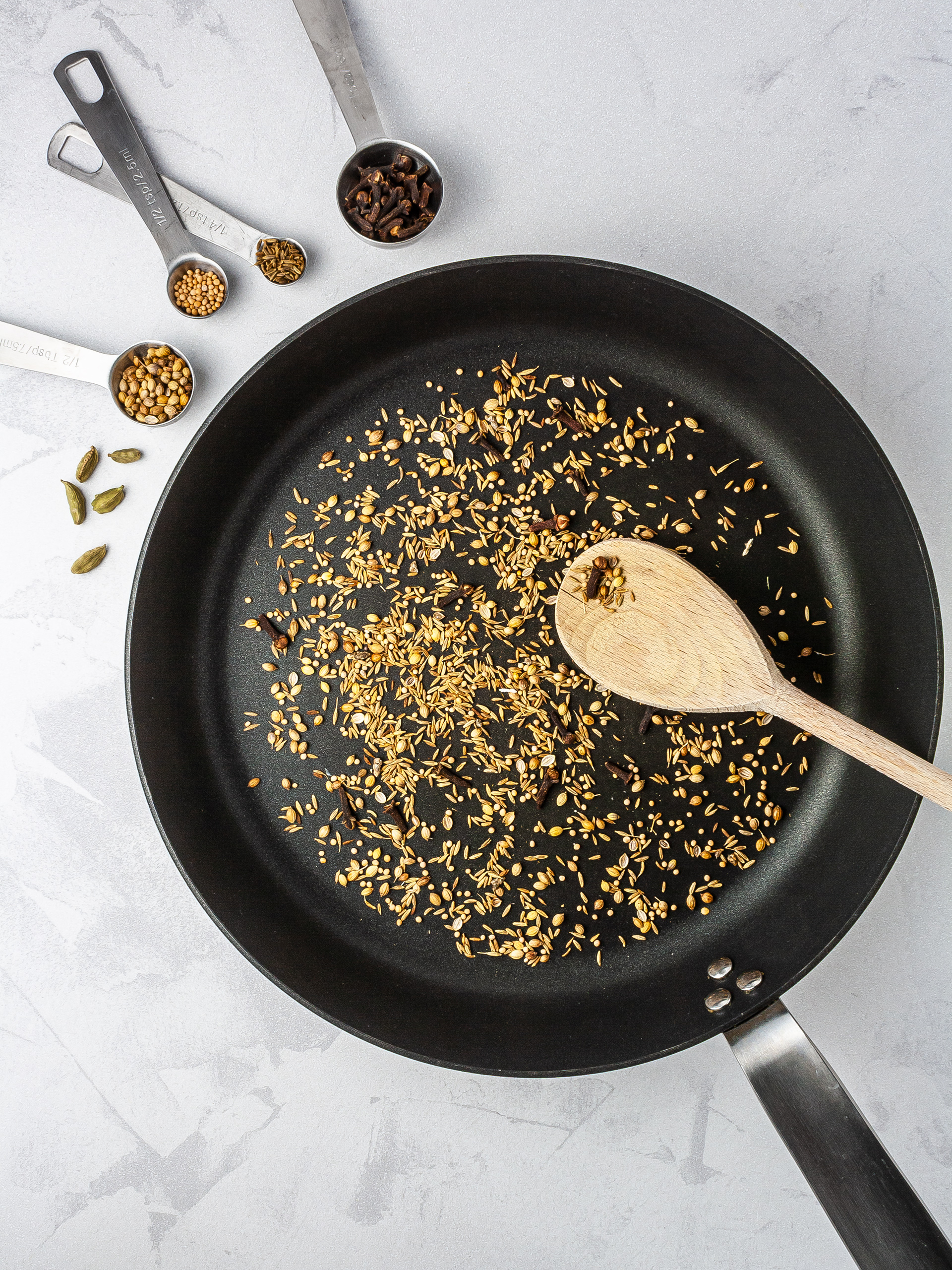 Toasted cumin, coriander, cardamom, and mustard seeds.