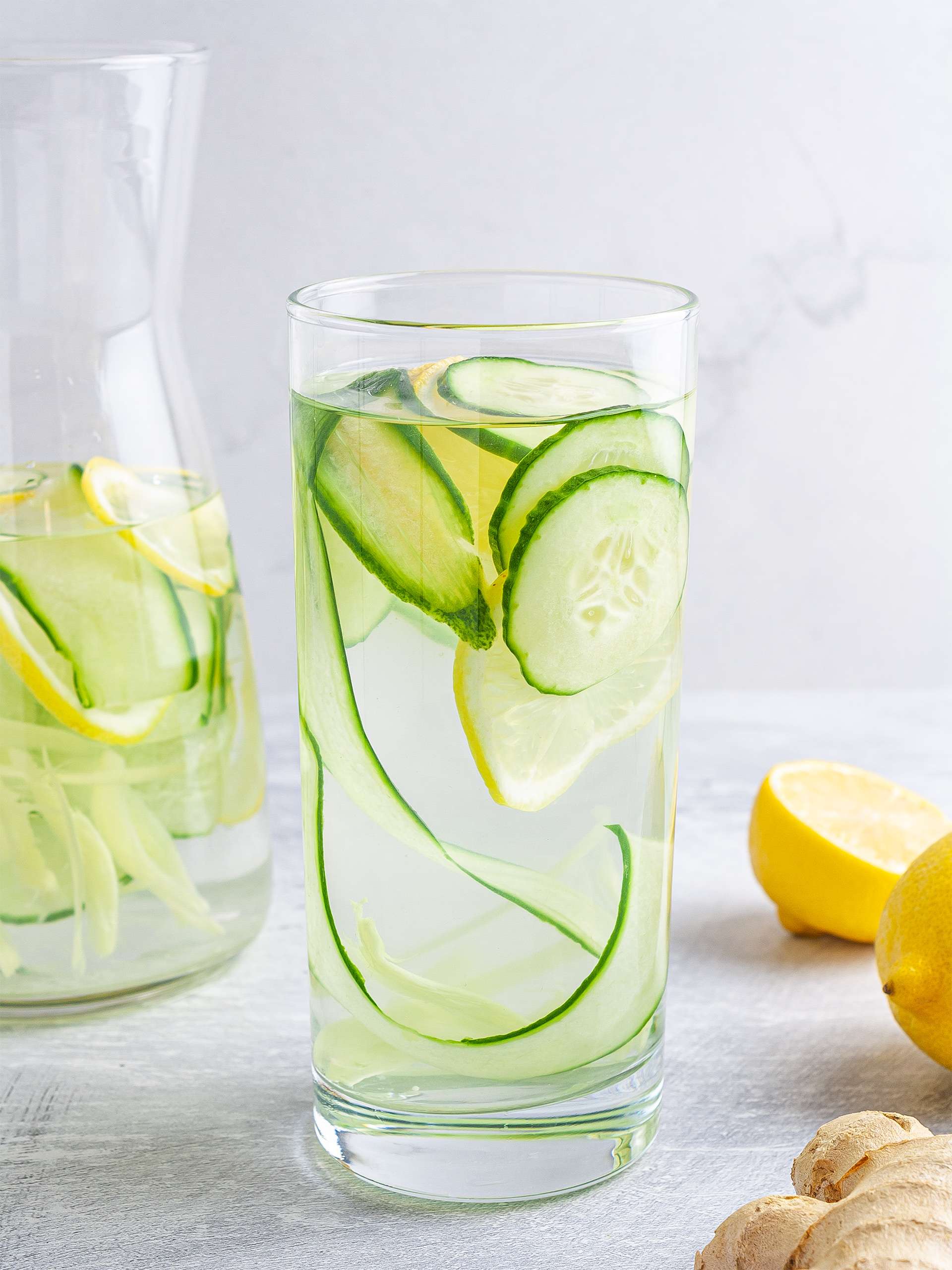 Cucumber ginger lemon water in a glass