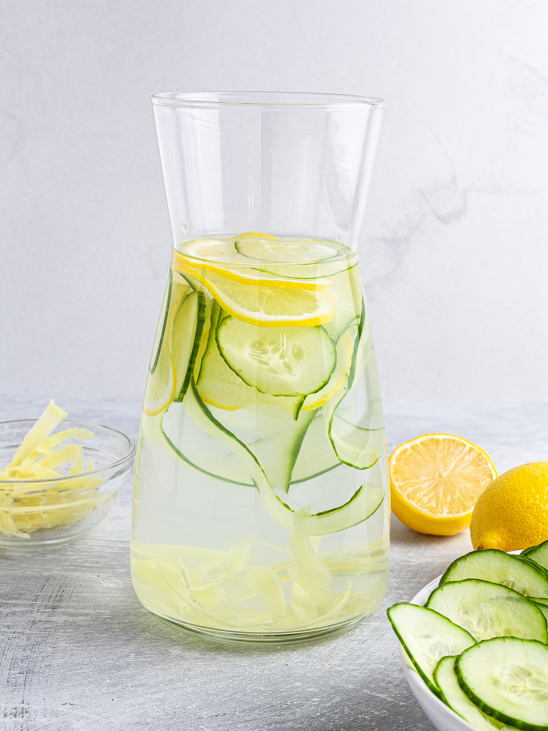 Cucumber ginger lemon water in a jug