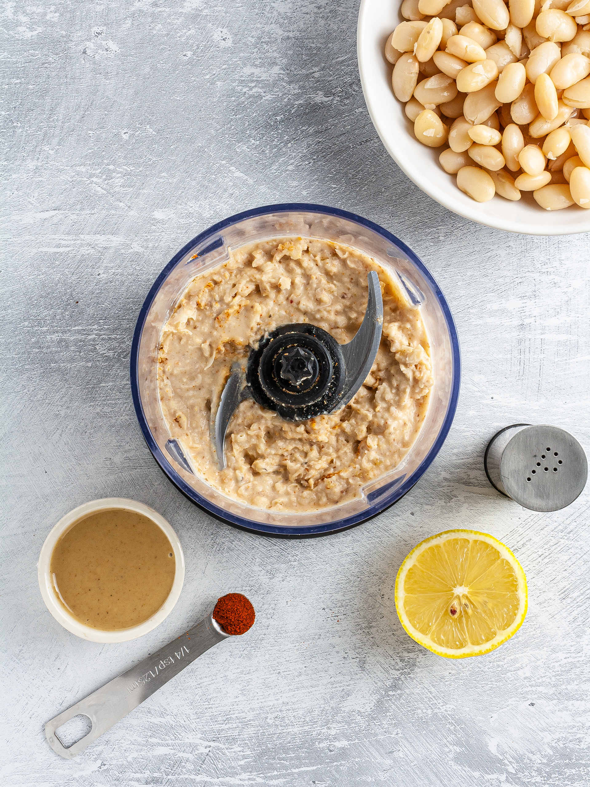 Blended white beans with tahini, lemon, and cayenne pepper.