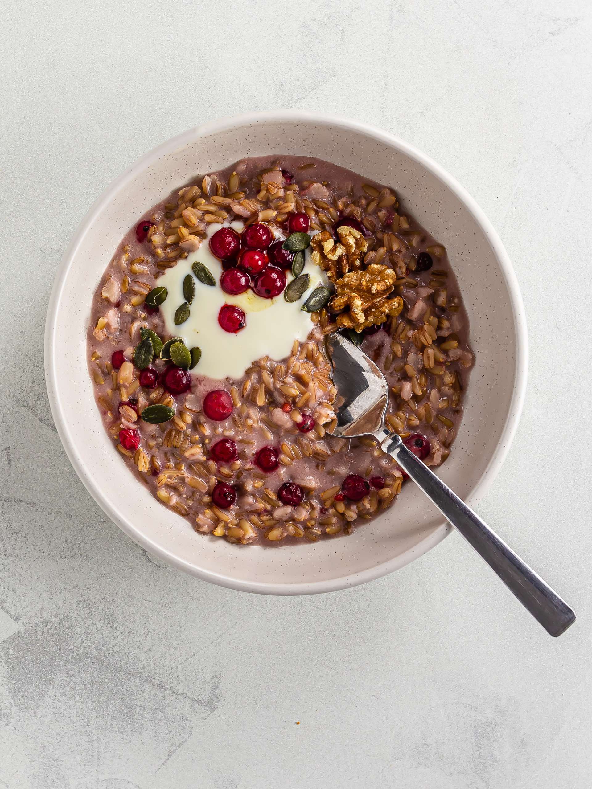 overnight oats groats hot cereal bowl with red currants