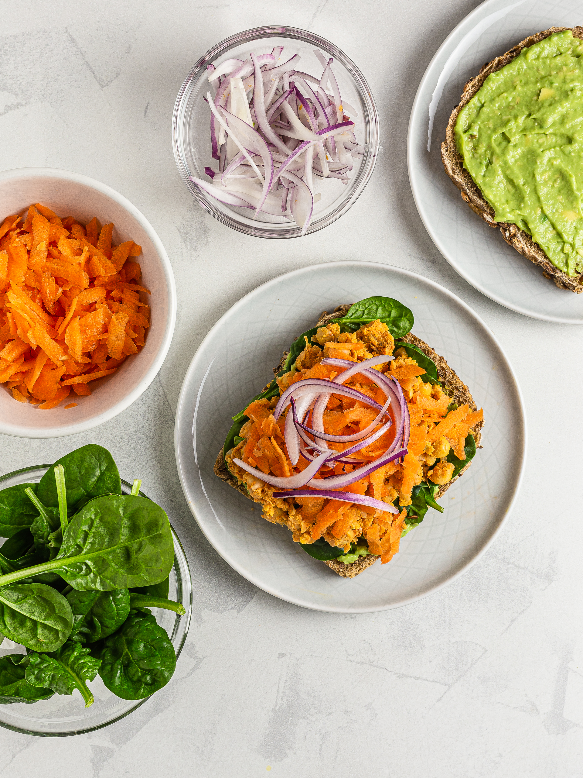 chickpea salad sandwich with carrots spinach and onions