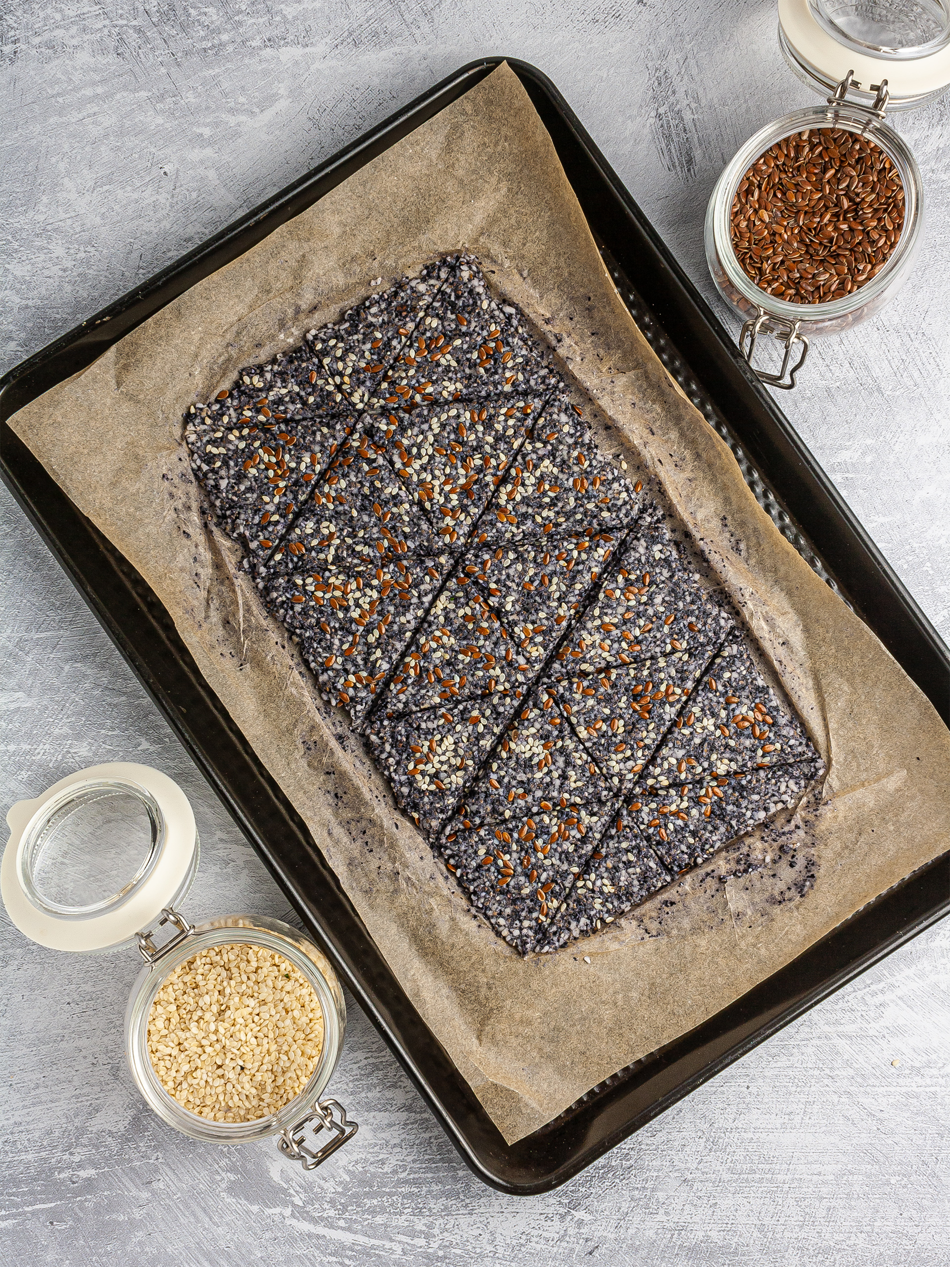 Black bean dough spread on baking paper