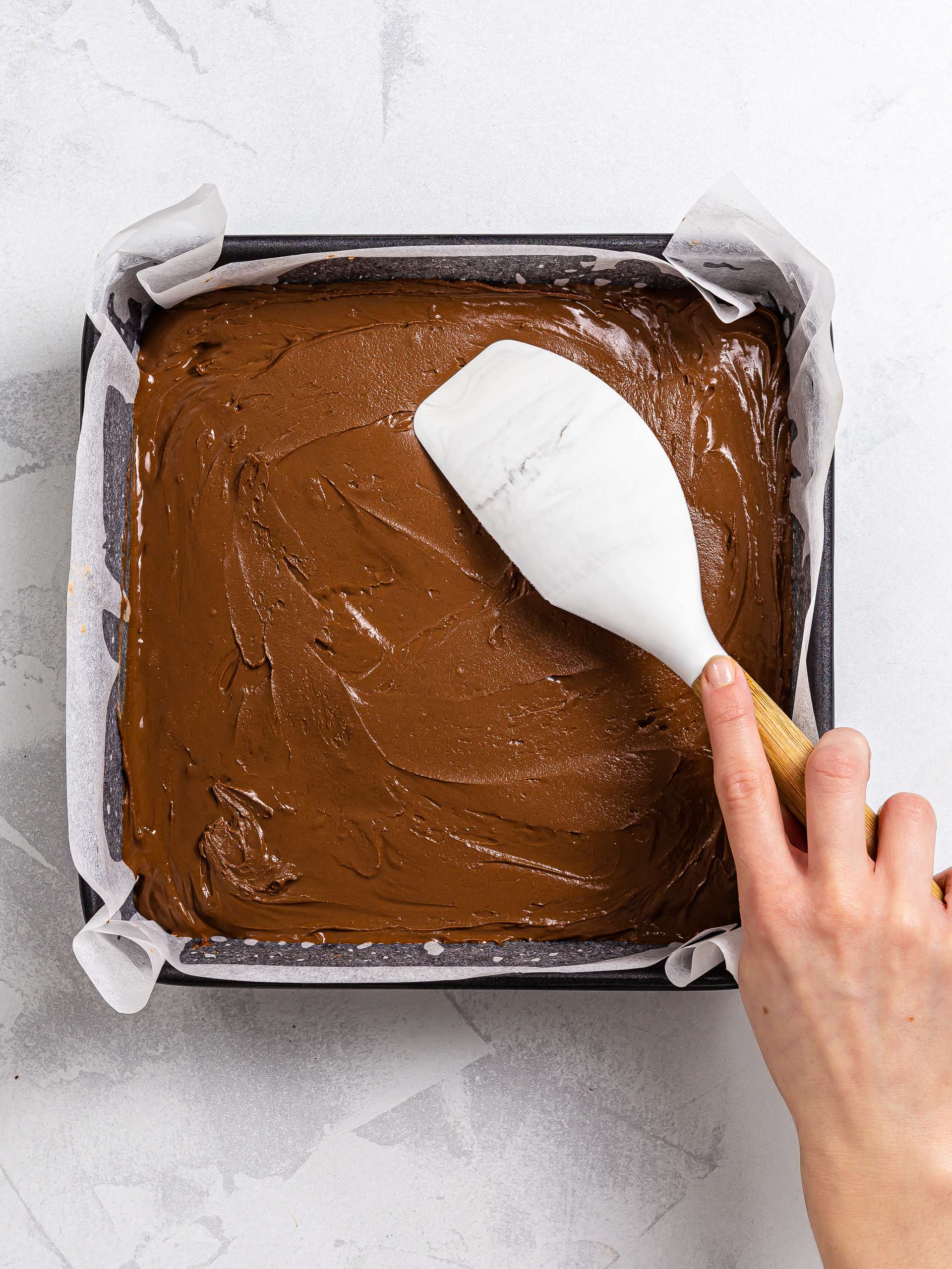 chocolate mochi brownie dough in a square baking tin