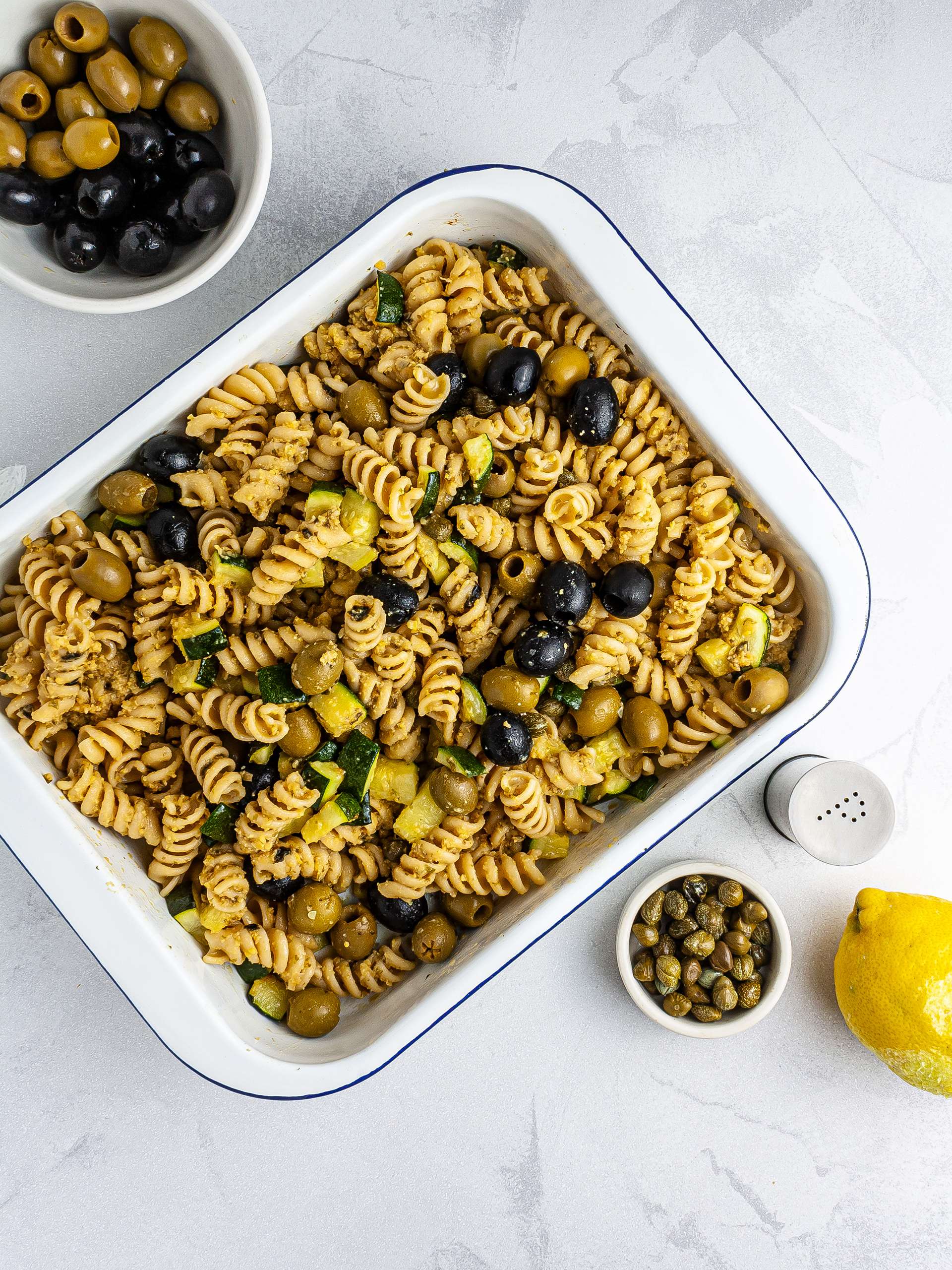 Pasta salad with olives, capers and lemon zest