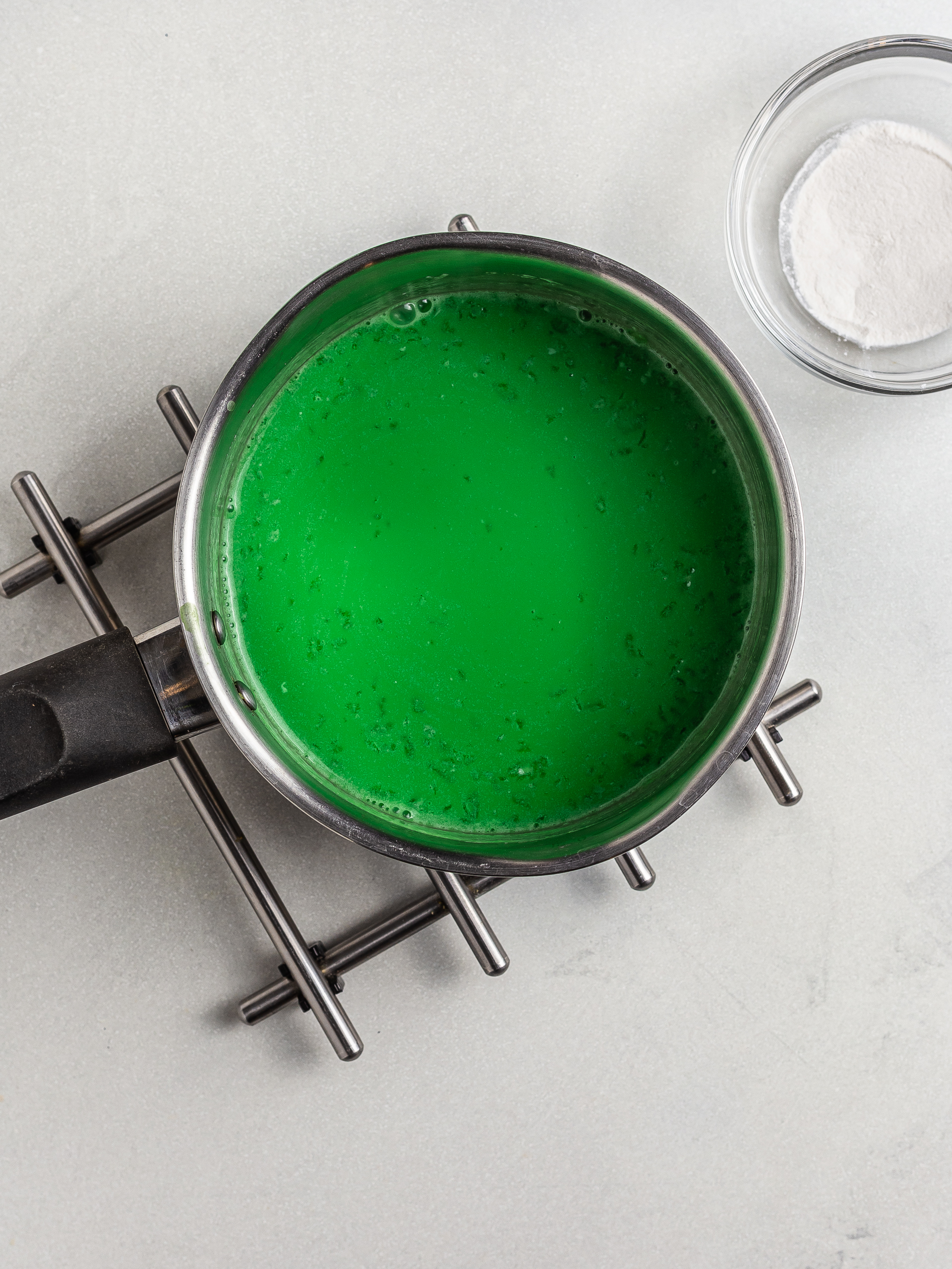 pandan milk jelly cooking in a pot