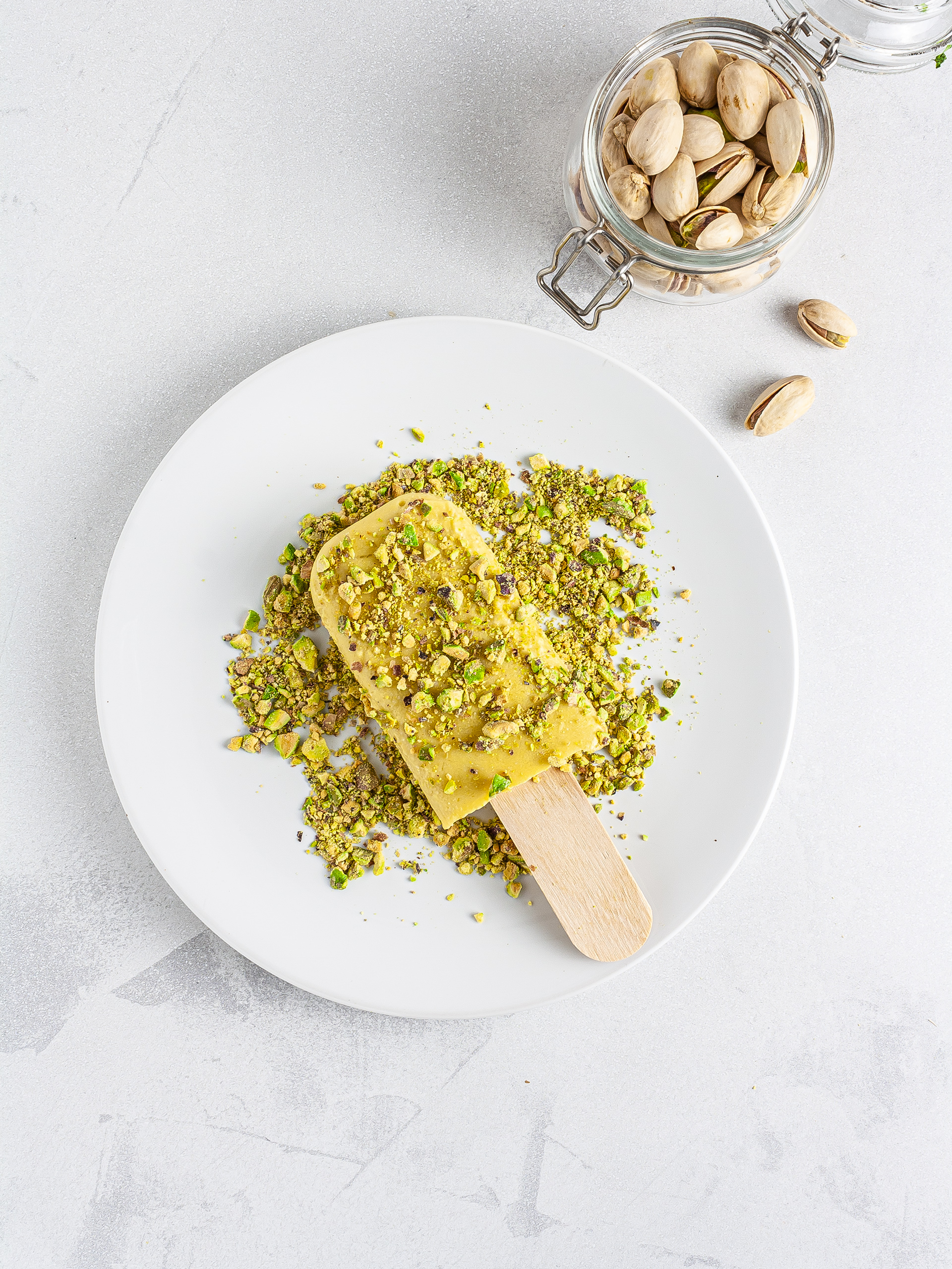 Mango kulfi coated in pistachios