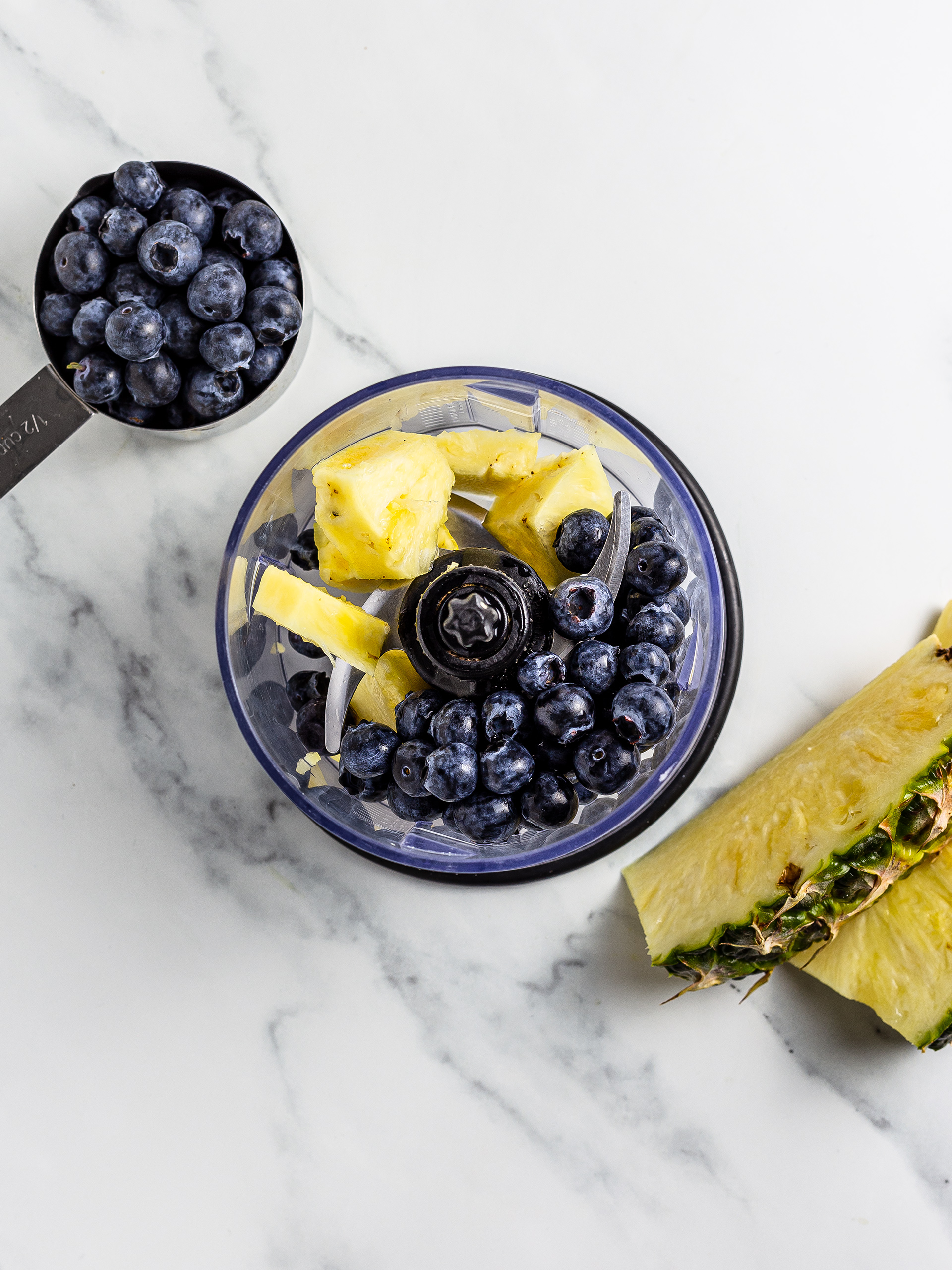 blueberries and pineapple in a blender