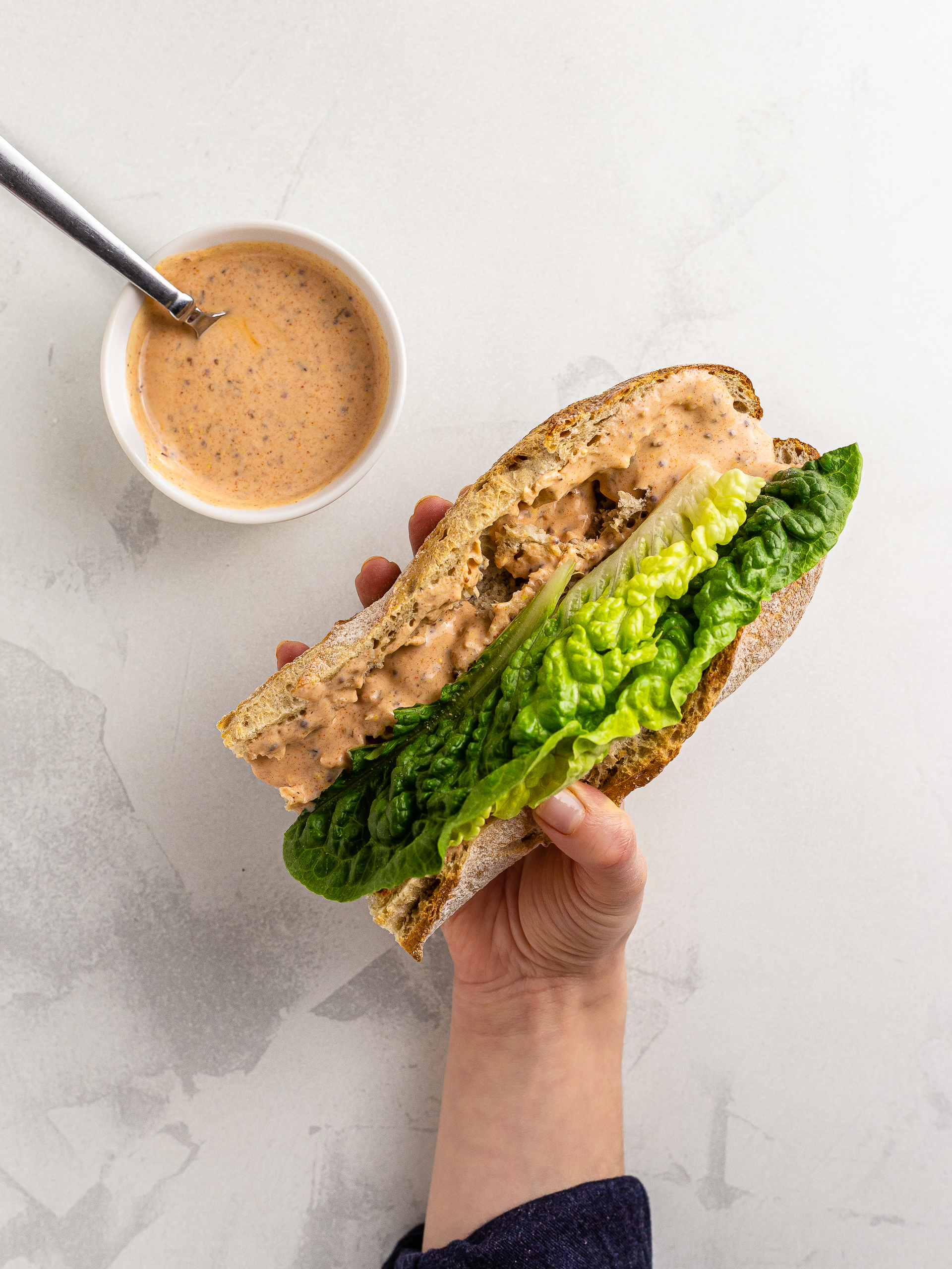 po boy sandwich with vegan remoulade and lettuce