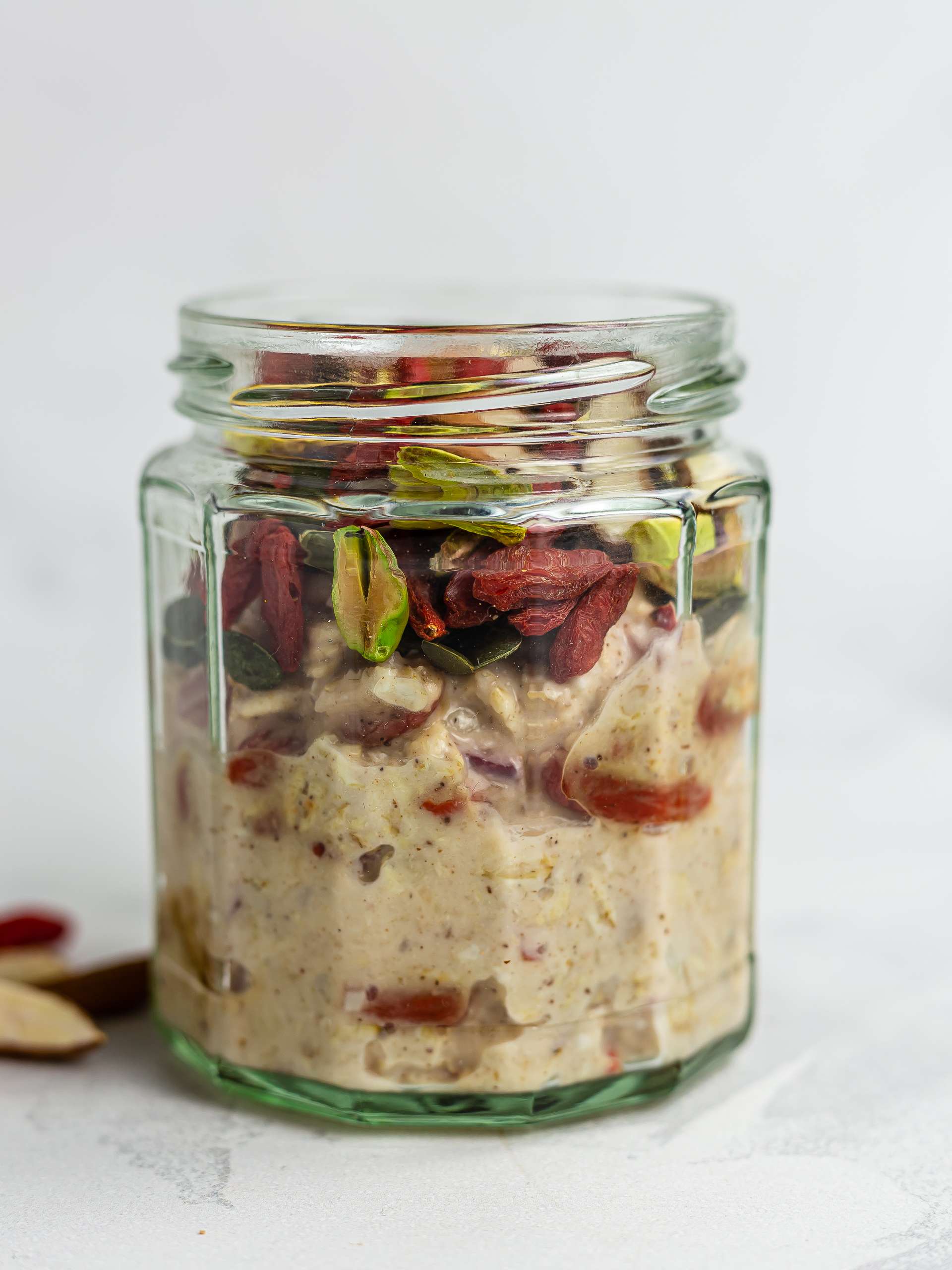 pistachios, almond, and pumpkin seeds with bircher muesli in a jar