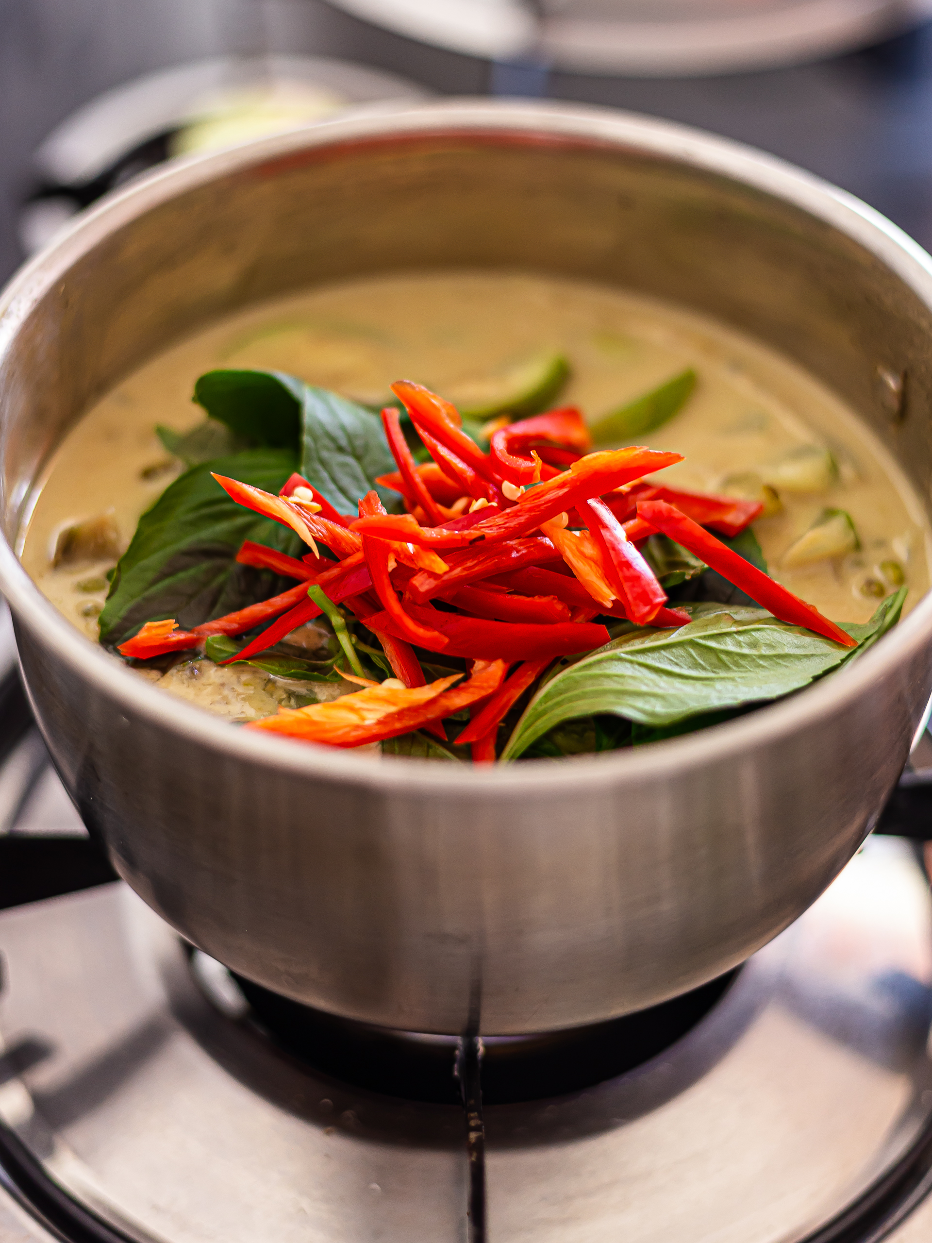 chillies and basil in thai green curry