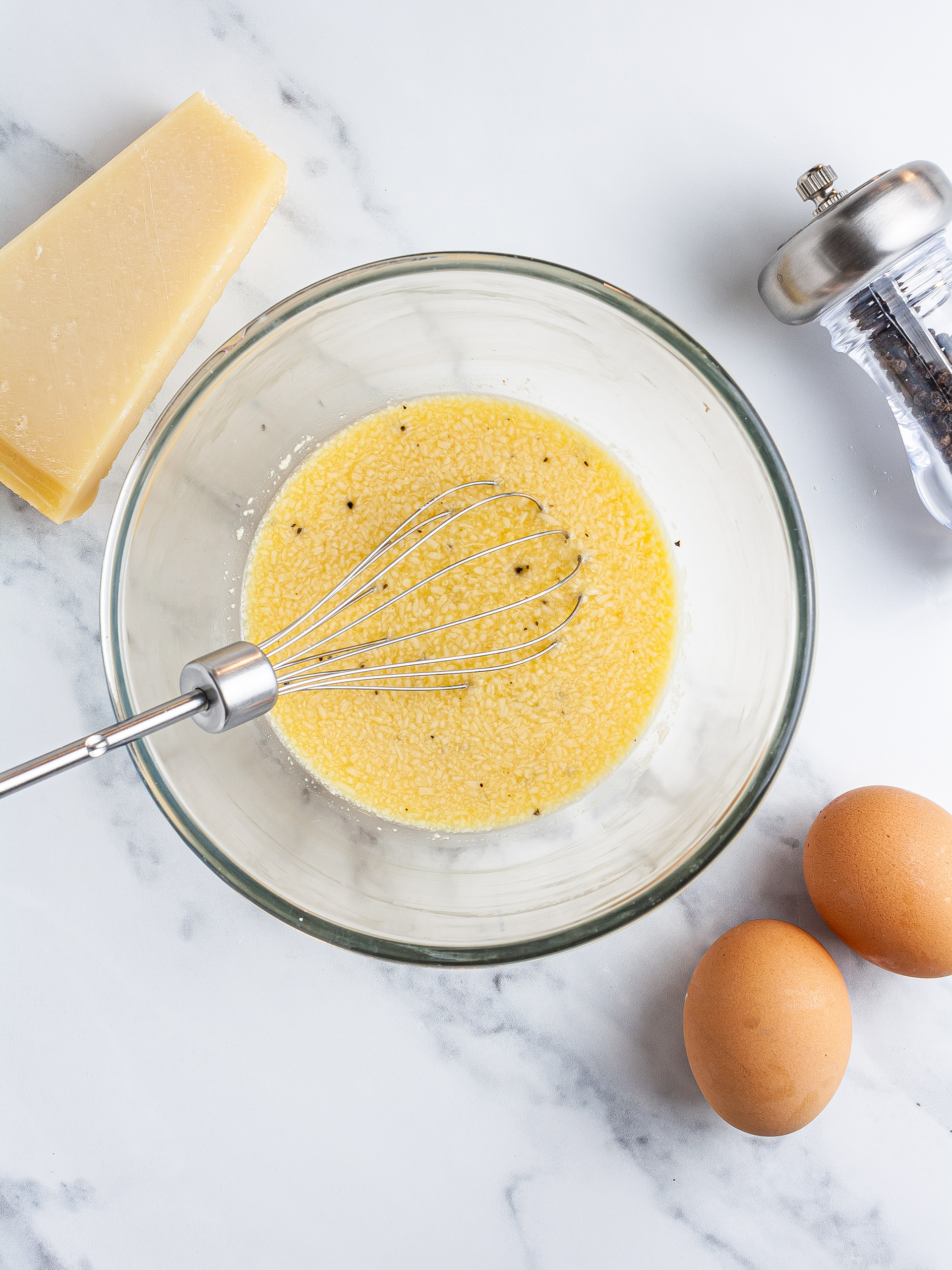 Eggs beaten with parmesan and pepper.