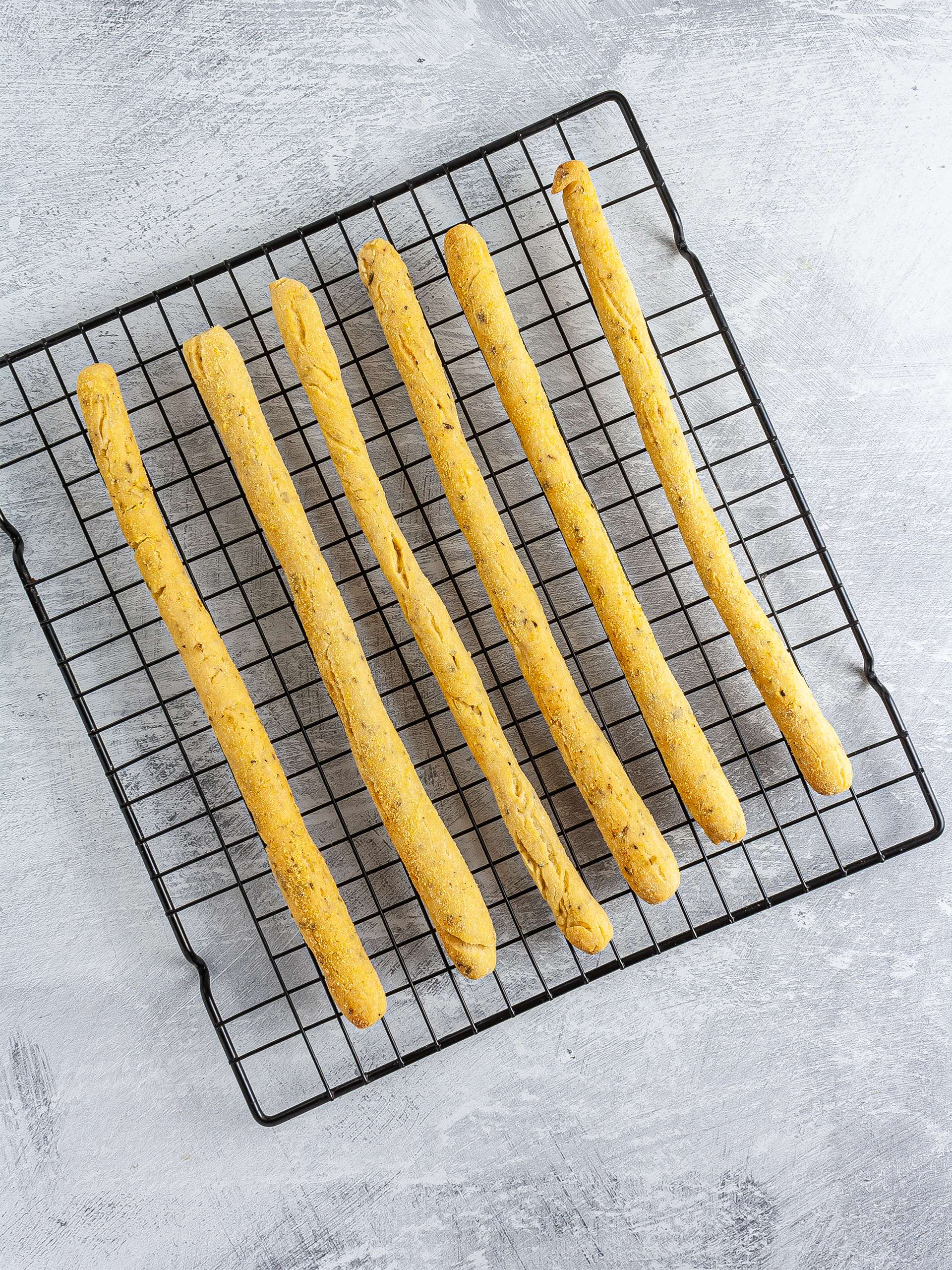 Baked breadsticks on a wire rack