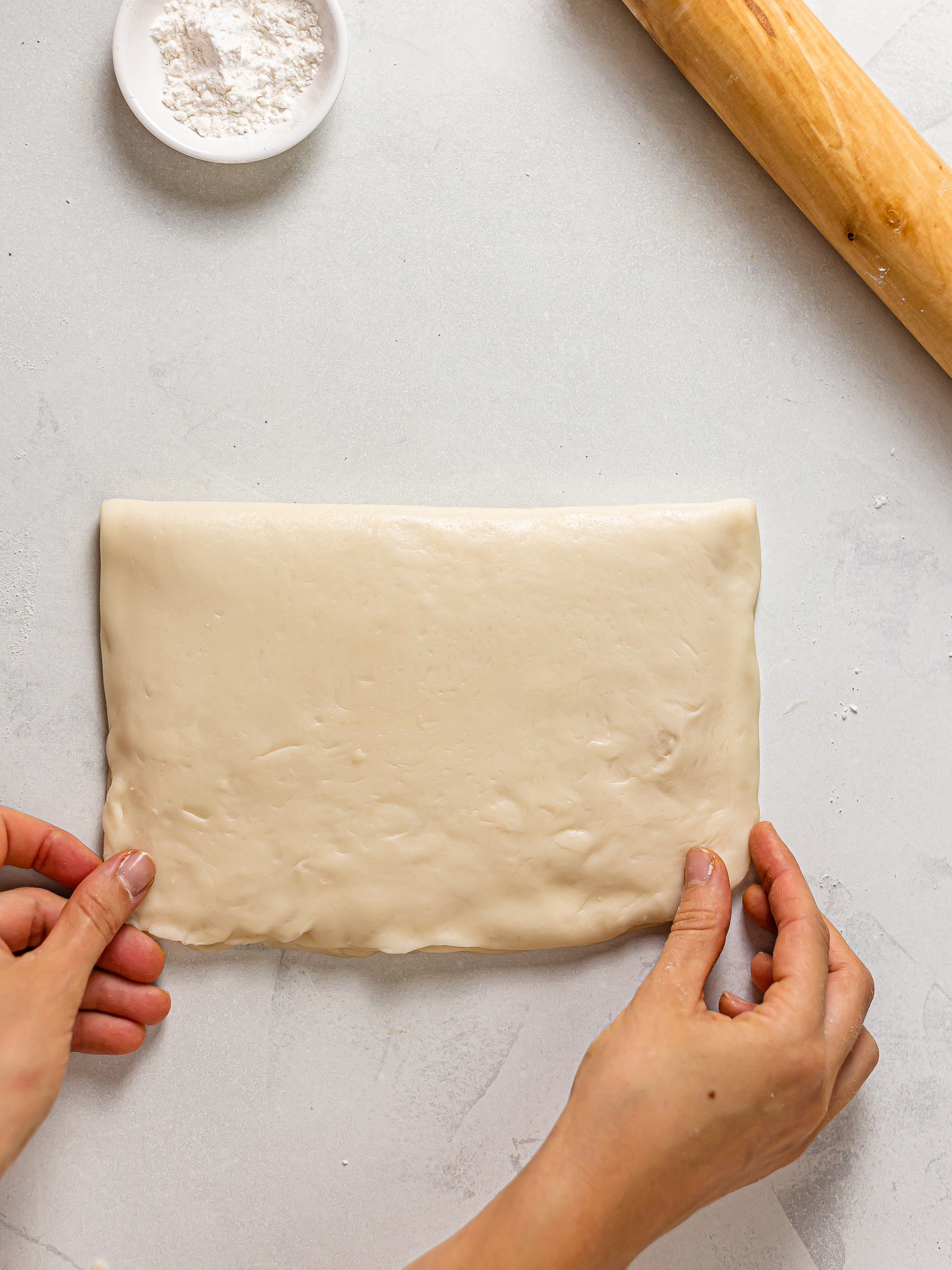dough folded over the oil dough layer for hopia pastry