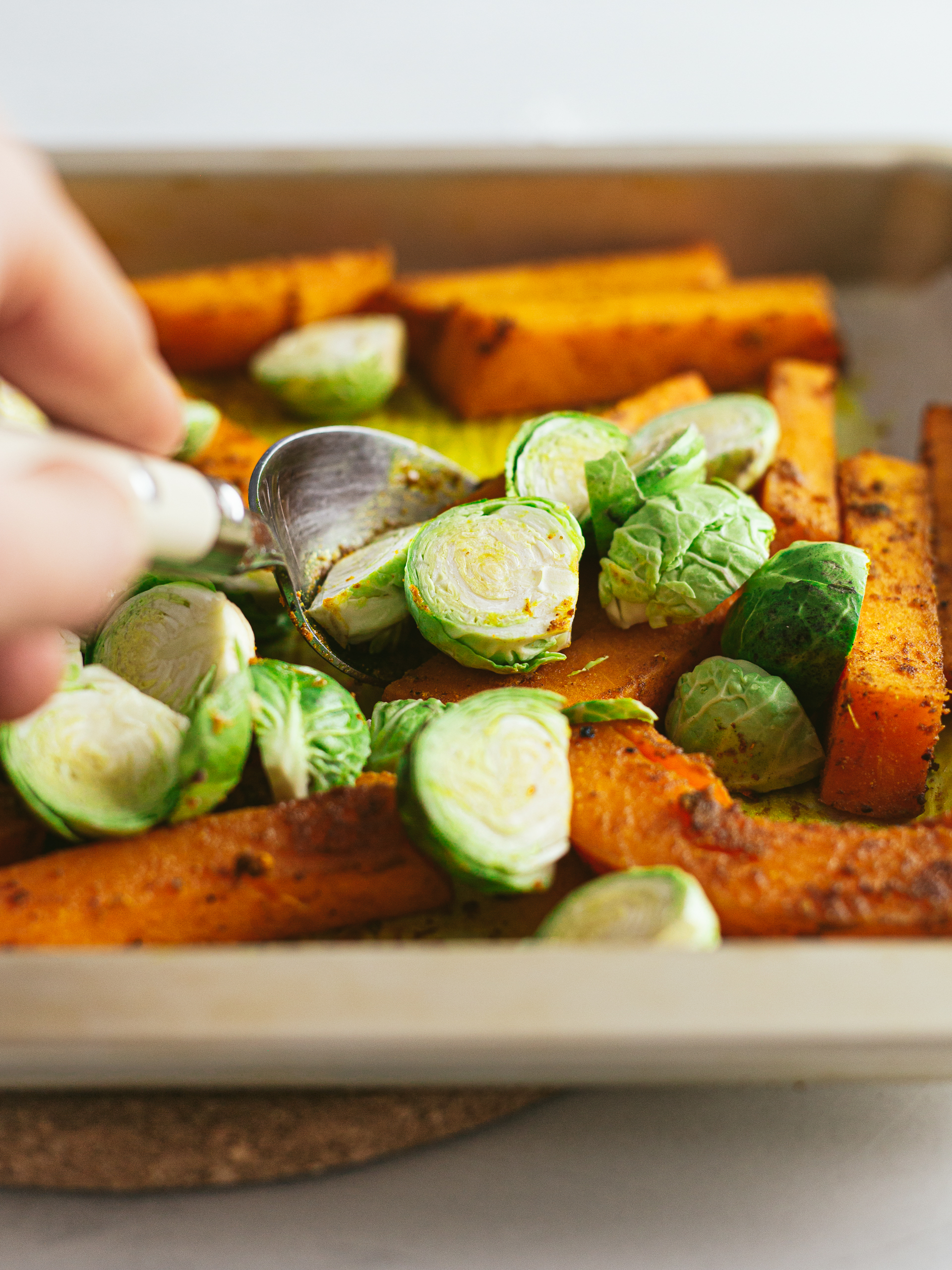 roasted pumpkin with brussel sprouts in a tray