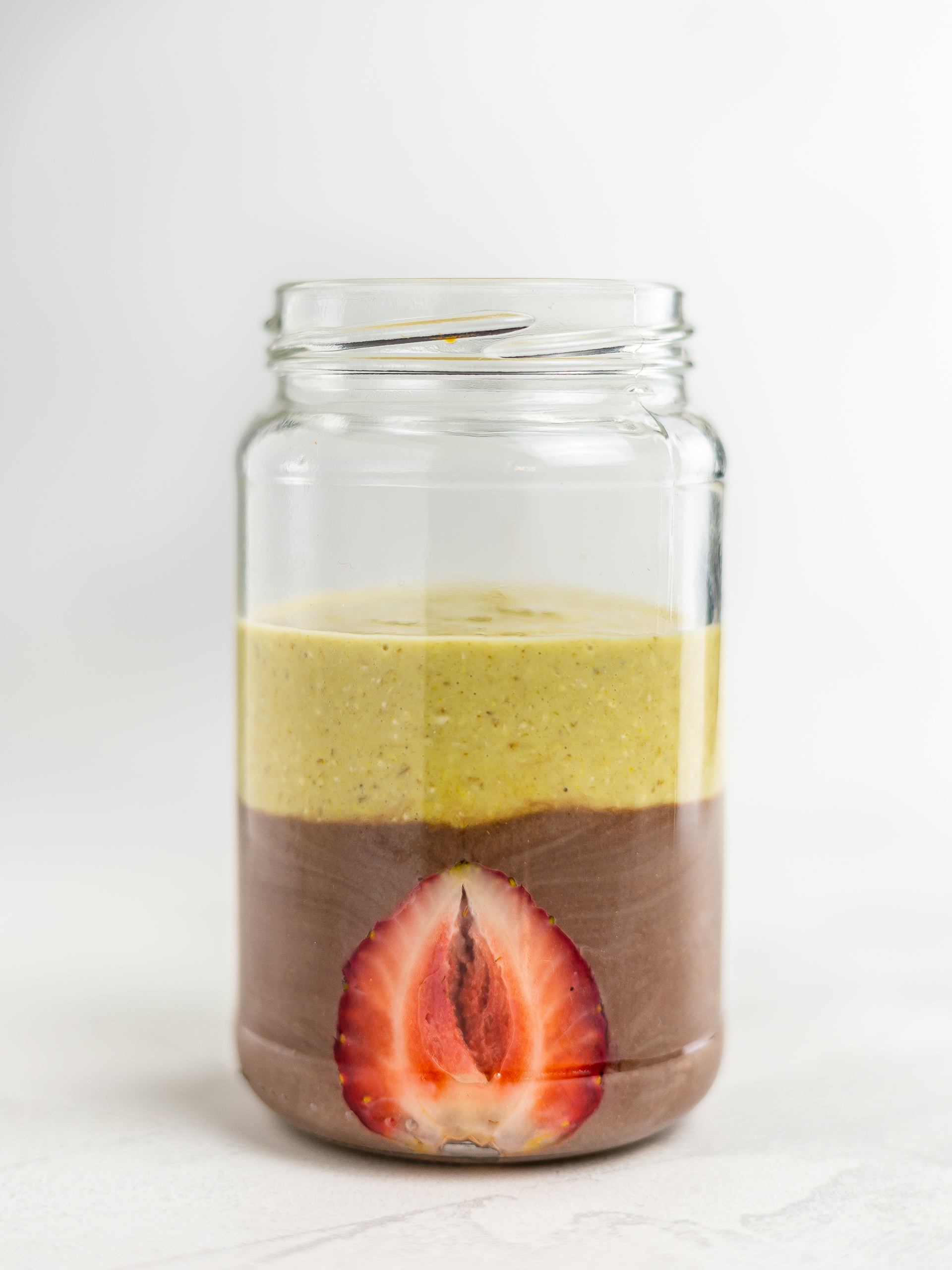 chocolate banana layered smoothie in a jar