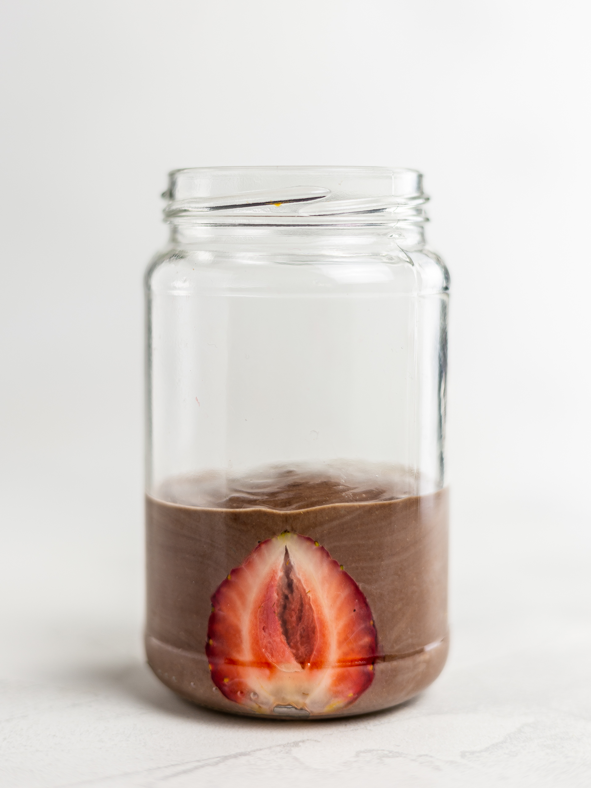 chocolate layered smoothie in a jar