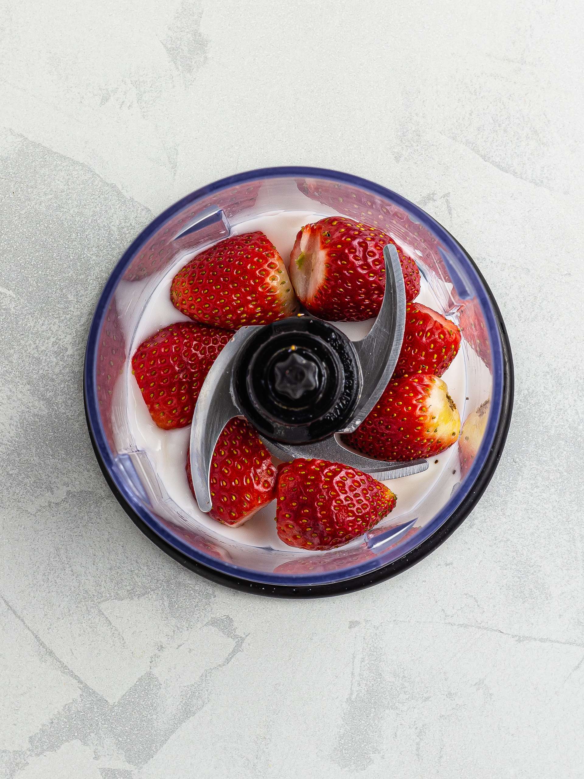 strawberries and yogurt in the blender