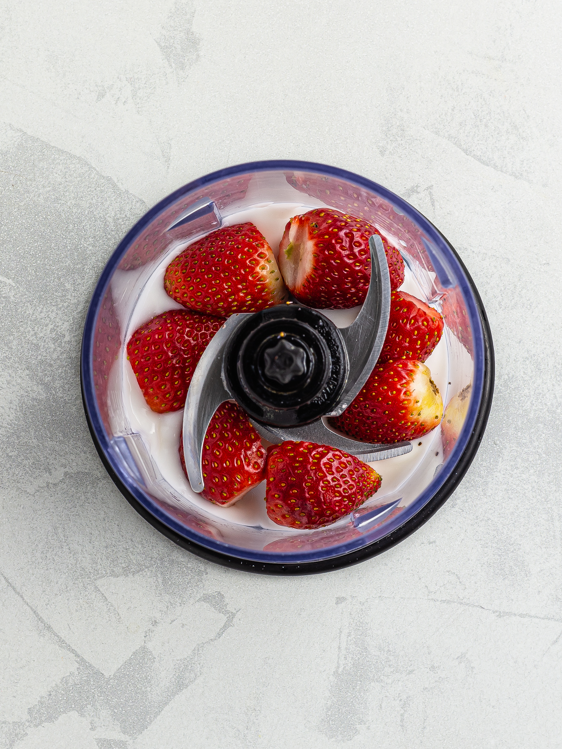 strawberries and yogurt in the blender