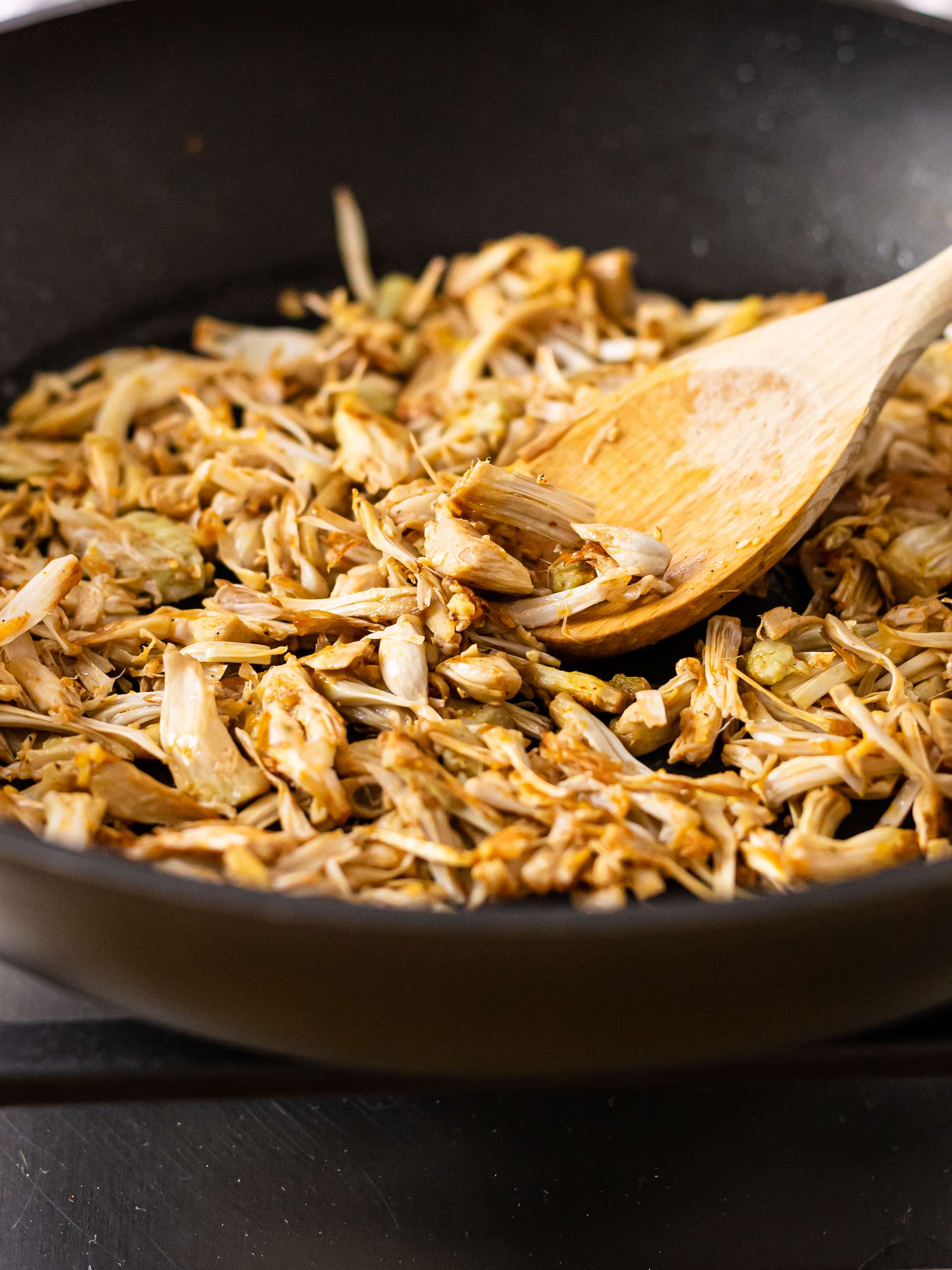 pulled jackfruit cooked in a skillet
