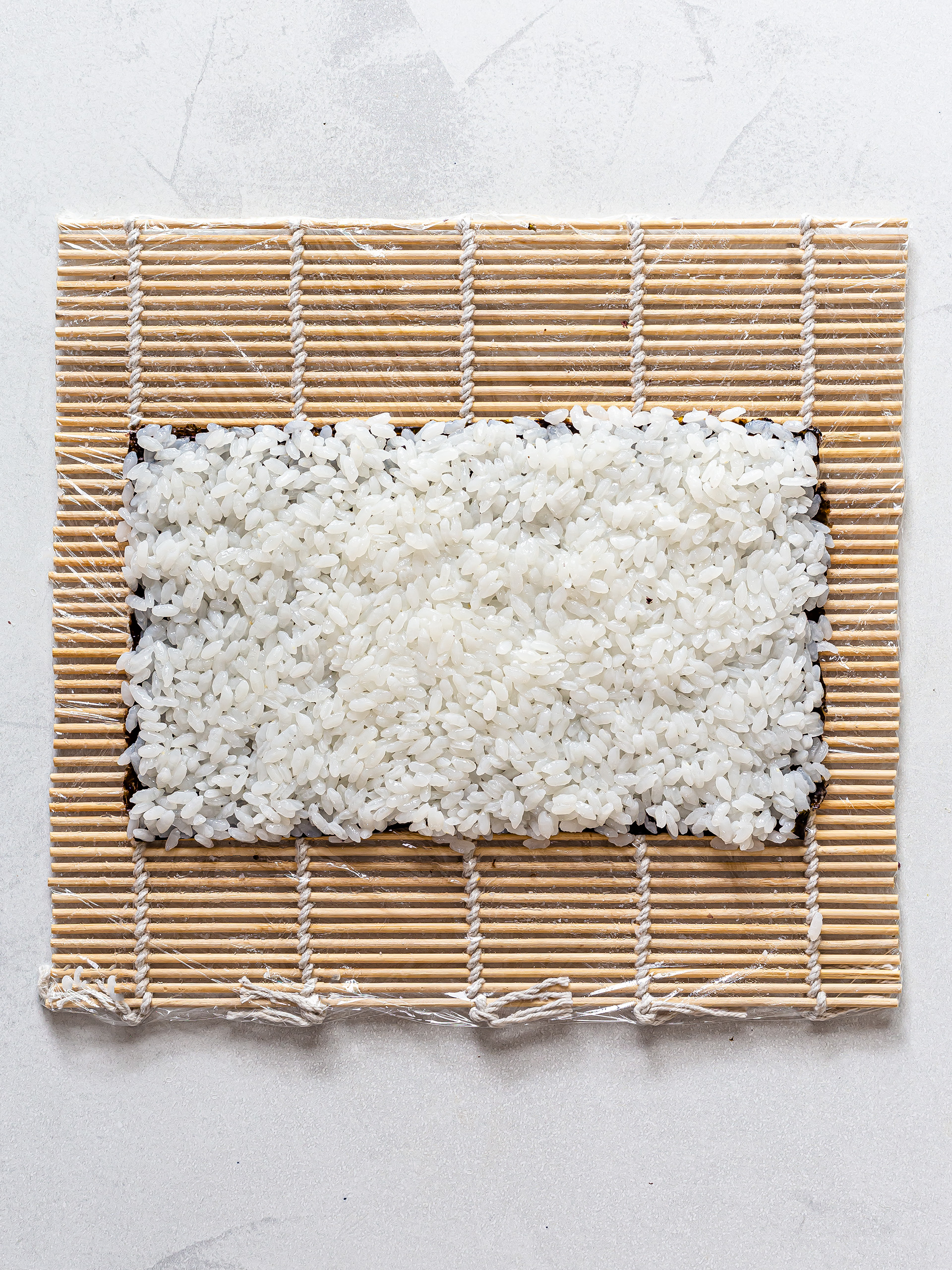 nori sheet covered with sushi rice