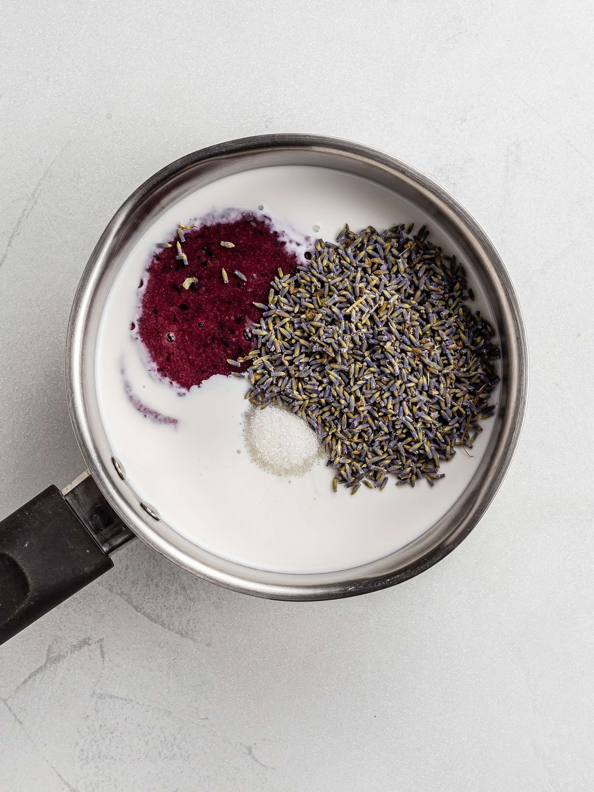 lavender, blueberry puree, and coconut milk in a pot