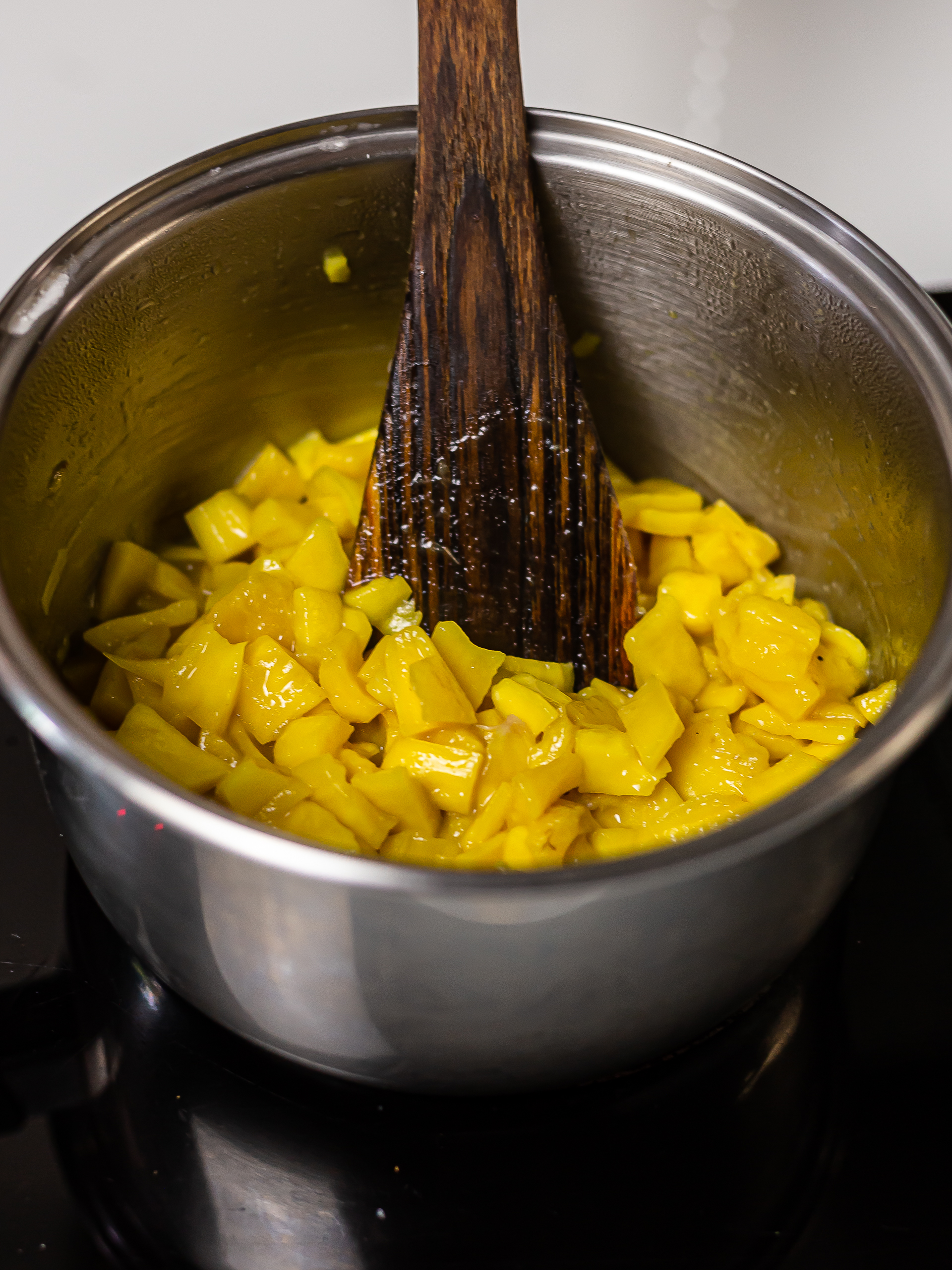 jackfruit pieces cooking in a pot for jam