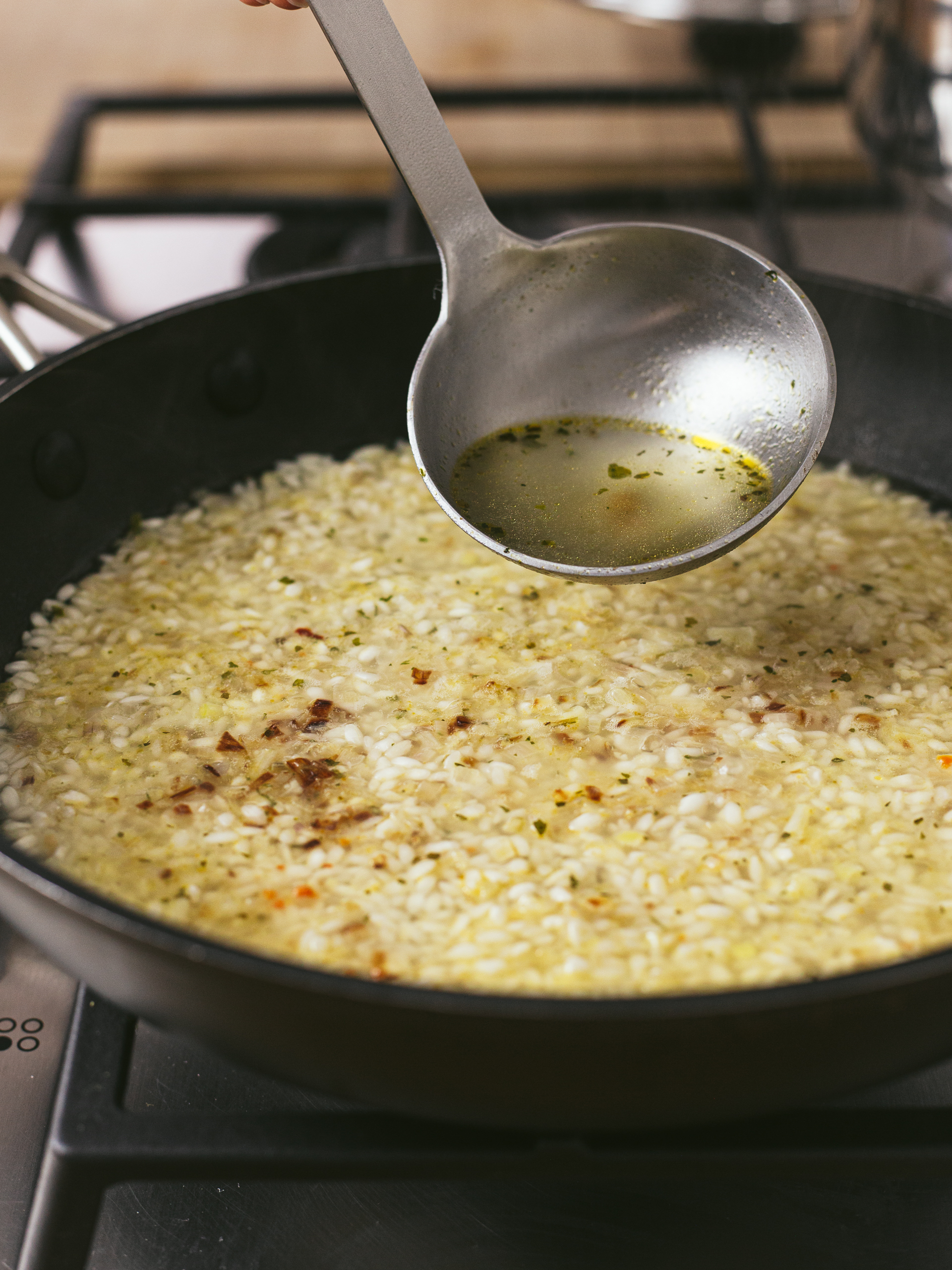 risotto rice cooking with vegetable broth