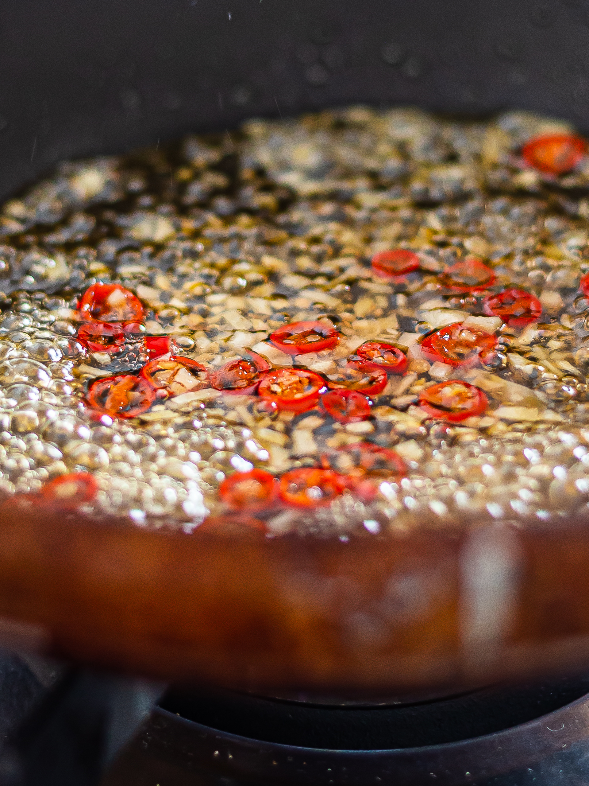 spicy honey glaze with garlic sizzling in a pan