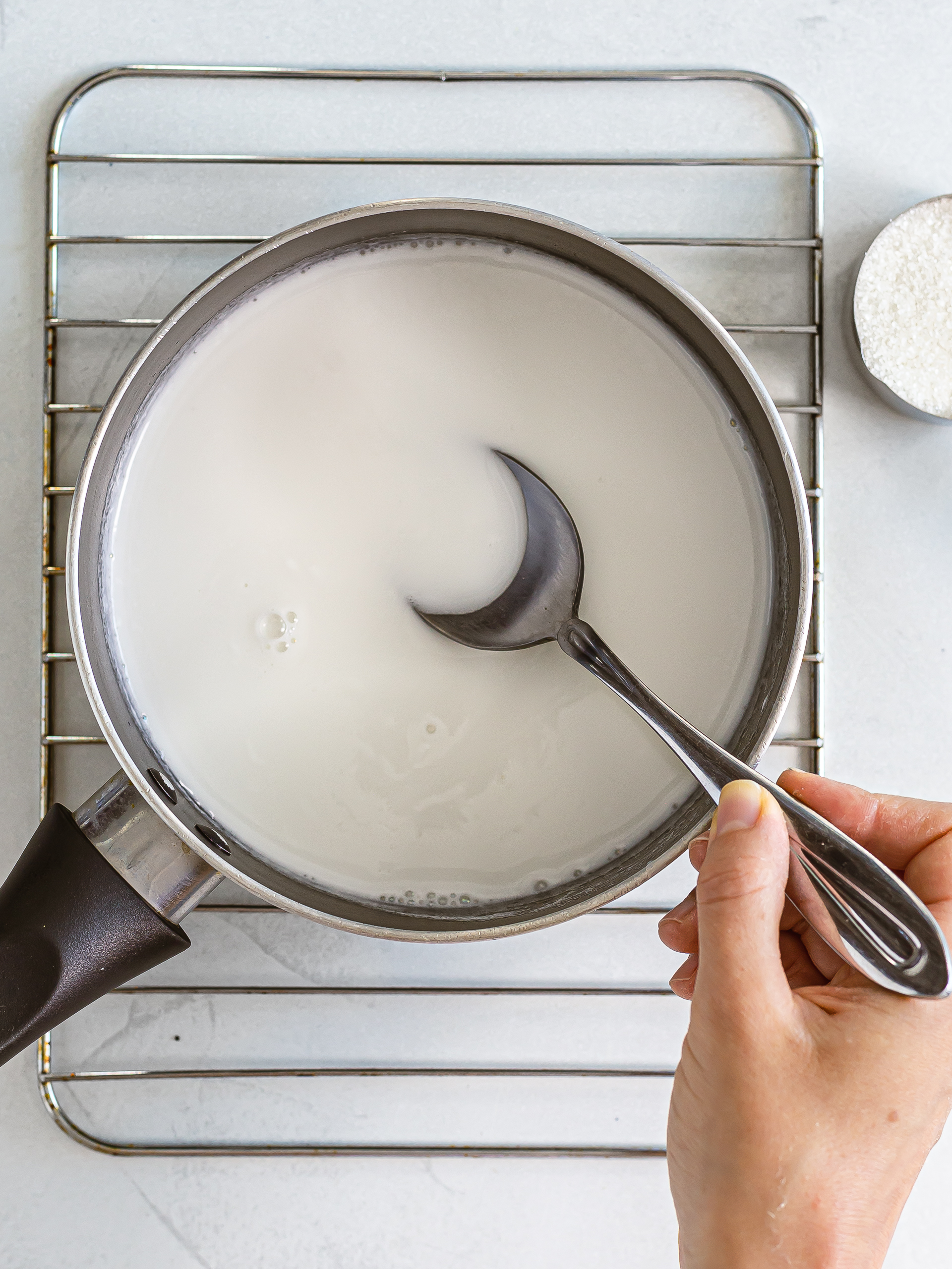 coconut milk sweetened with sugar in a pot