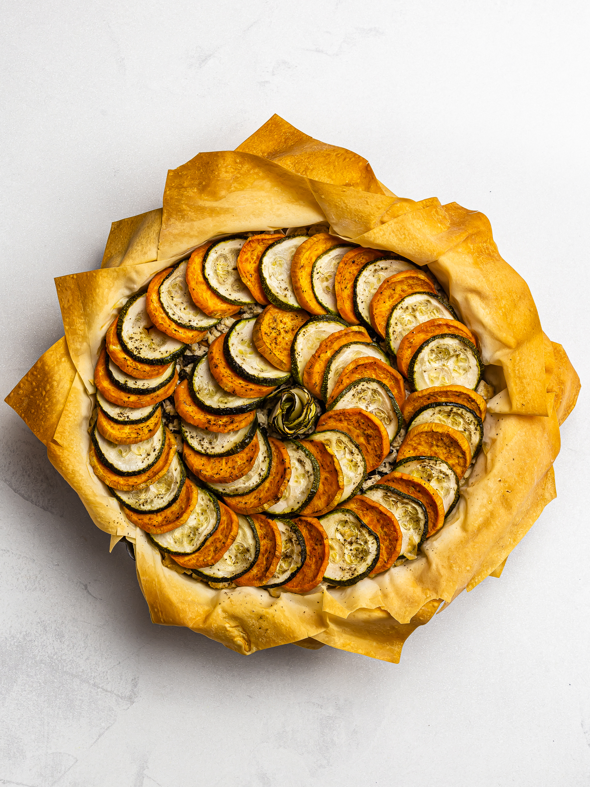 baked vegan boureki pie with tofu zucchini and sweet potatoes