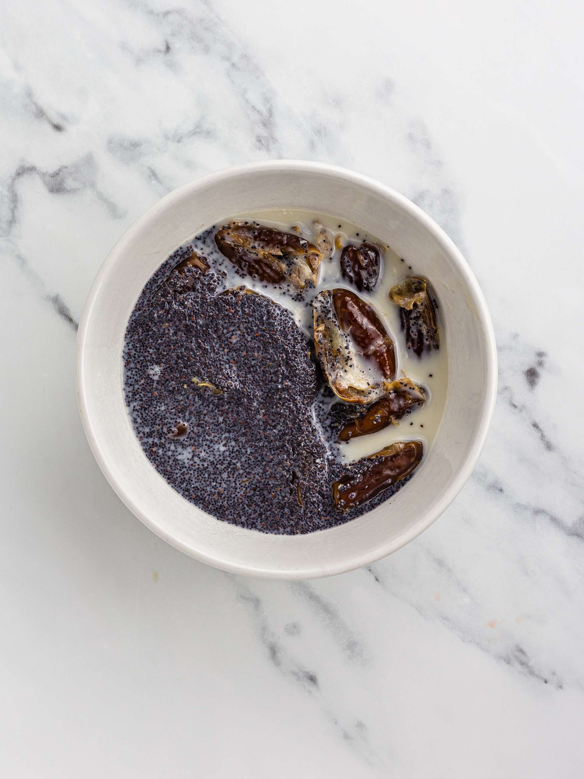 poppy seeds and dates soaking in hot milk