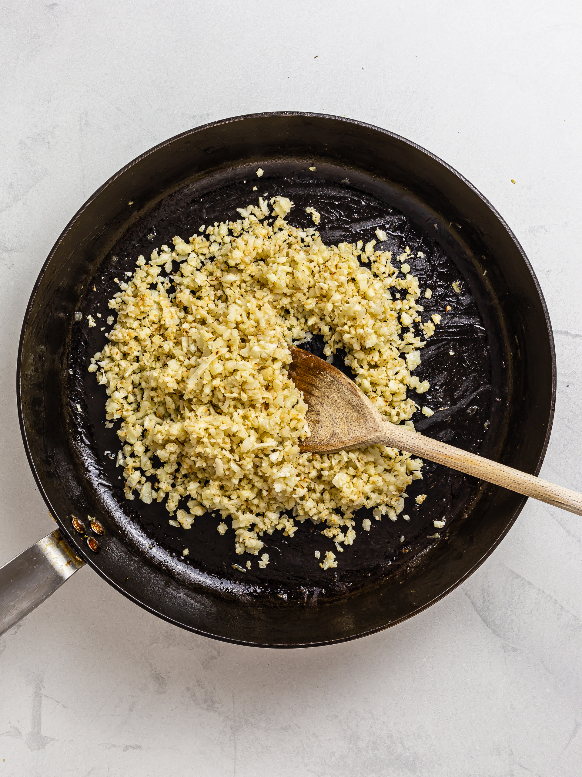 fried cauliflower rice in a skillet