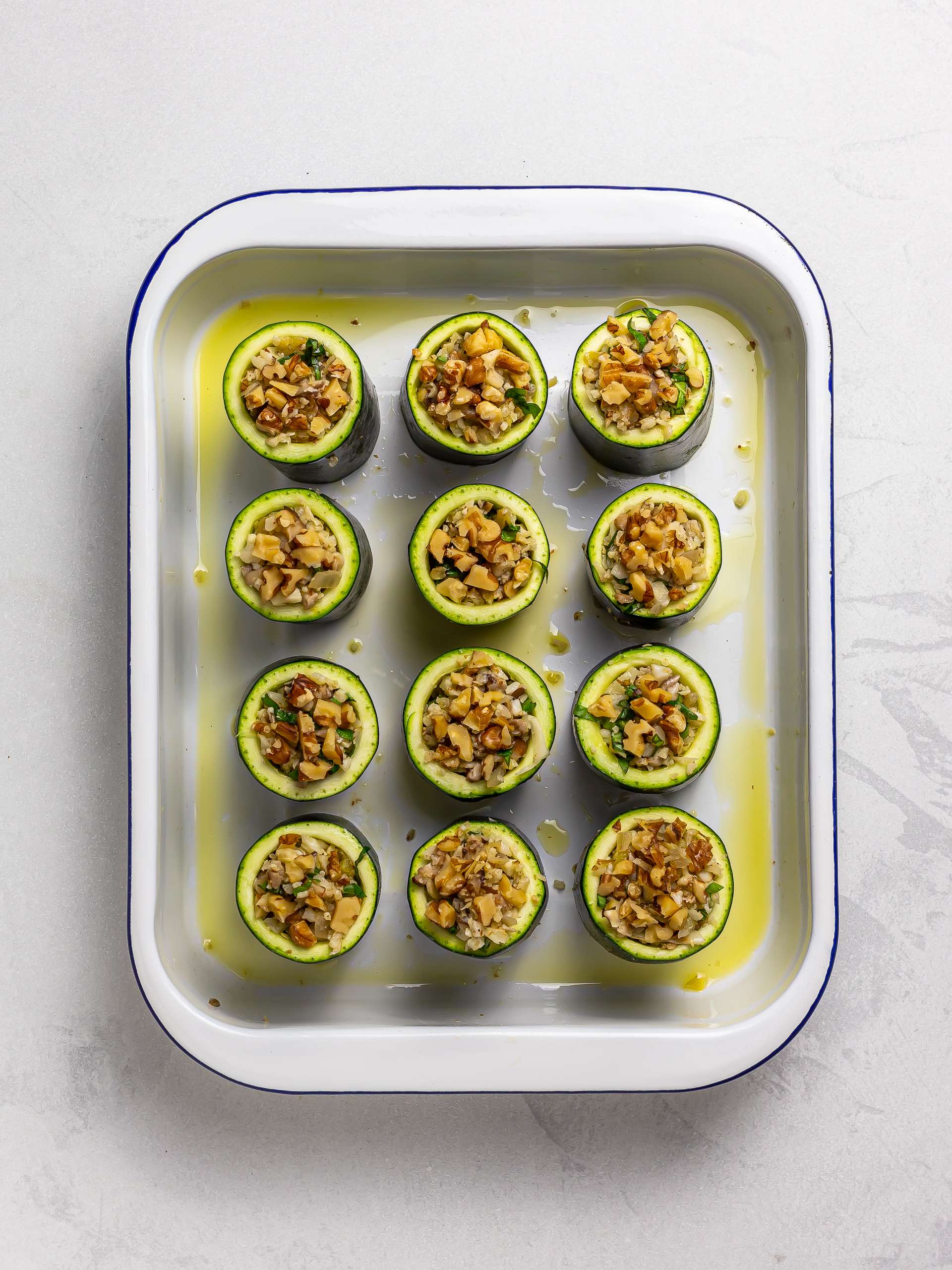 stuffed zucchini cups in a baking tray