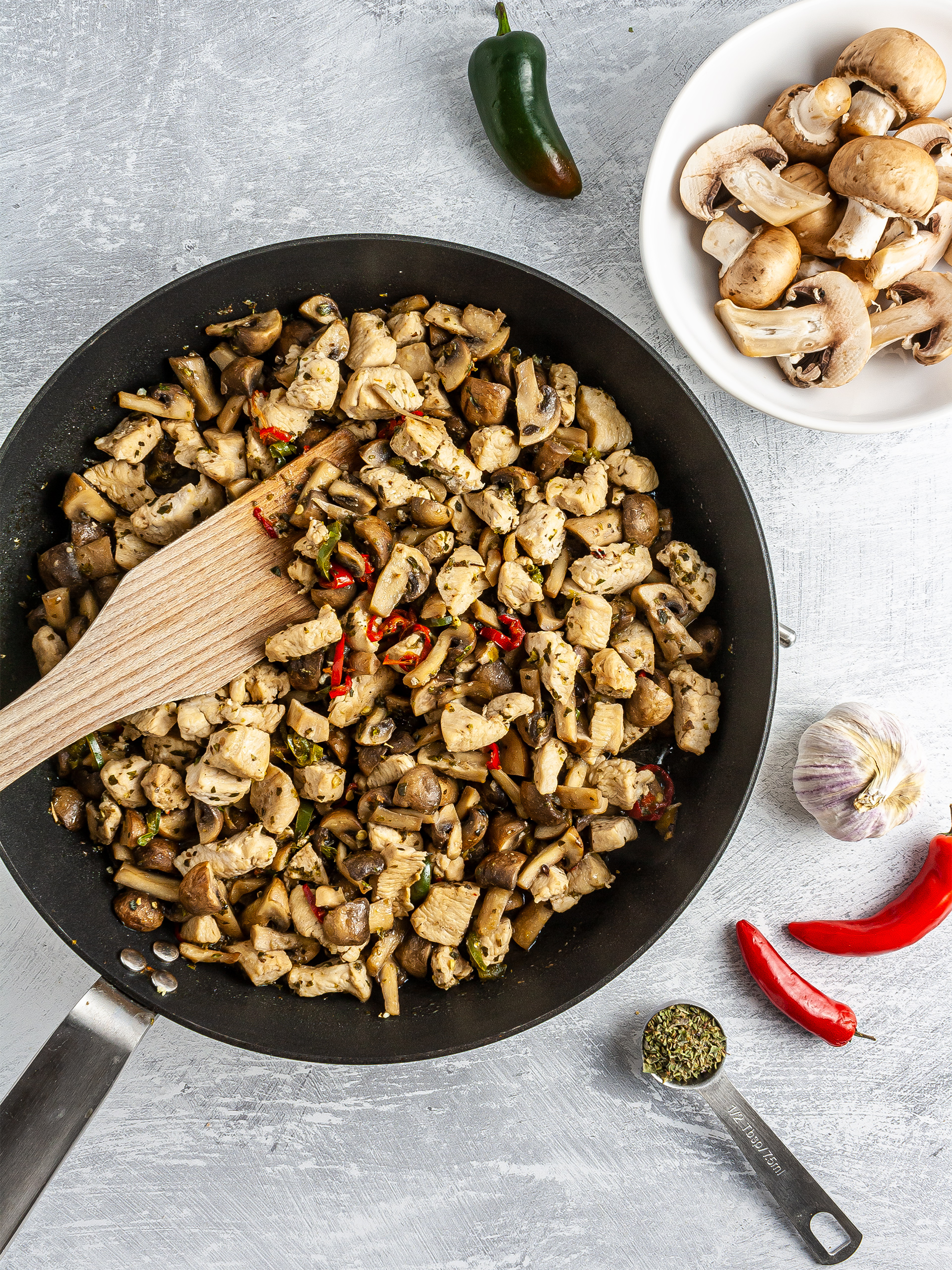 Cooked chicken and mushrooms with garlic and chillies