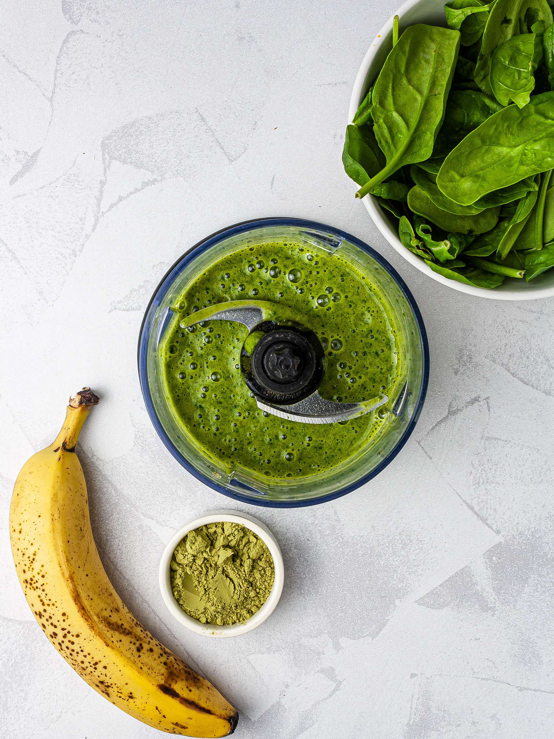 Green smoothie with spinach, banana, and match green tea powder.