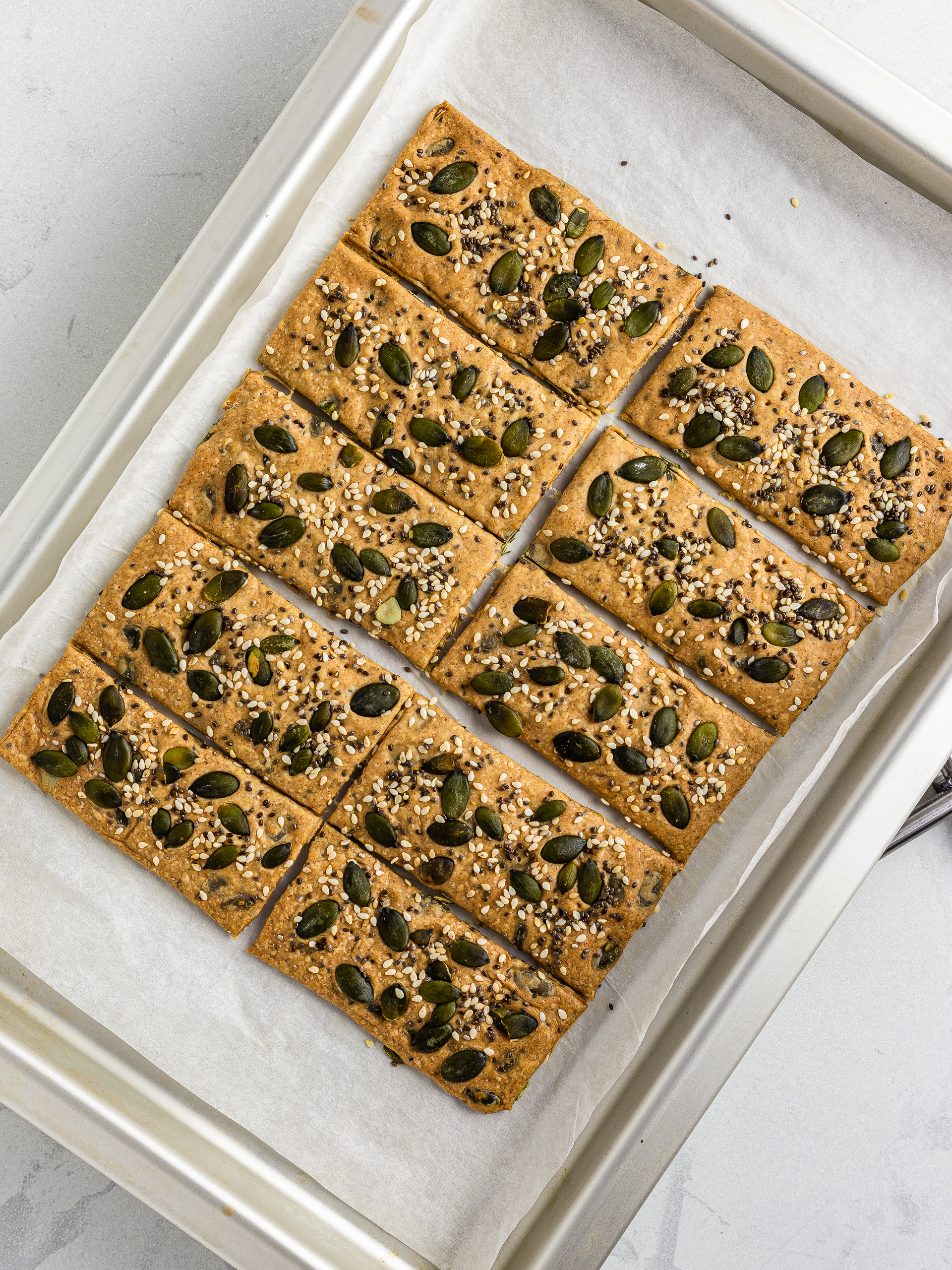 oven-baked spelt crackers on a baking tray