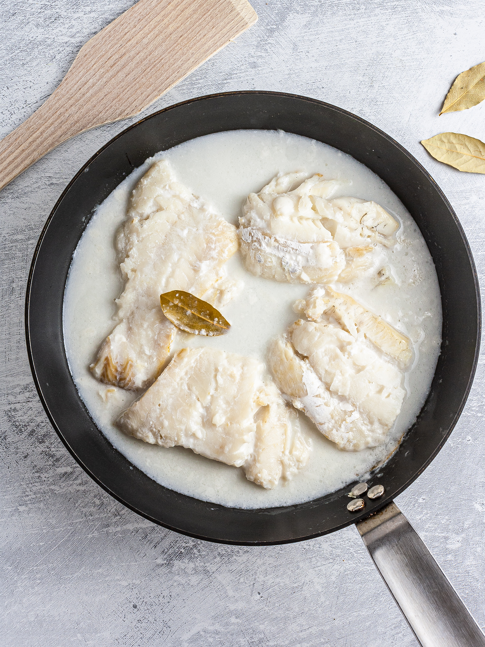 Cod cooked in soy milk and bay leaves