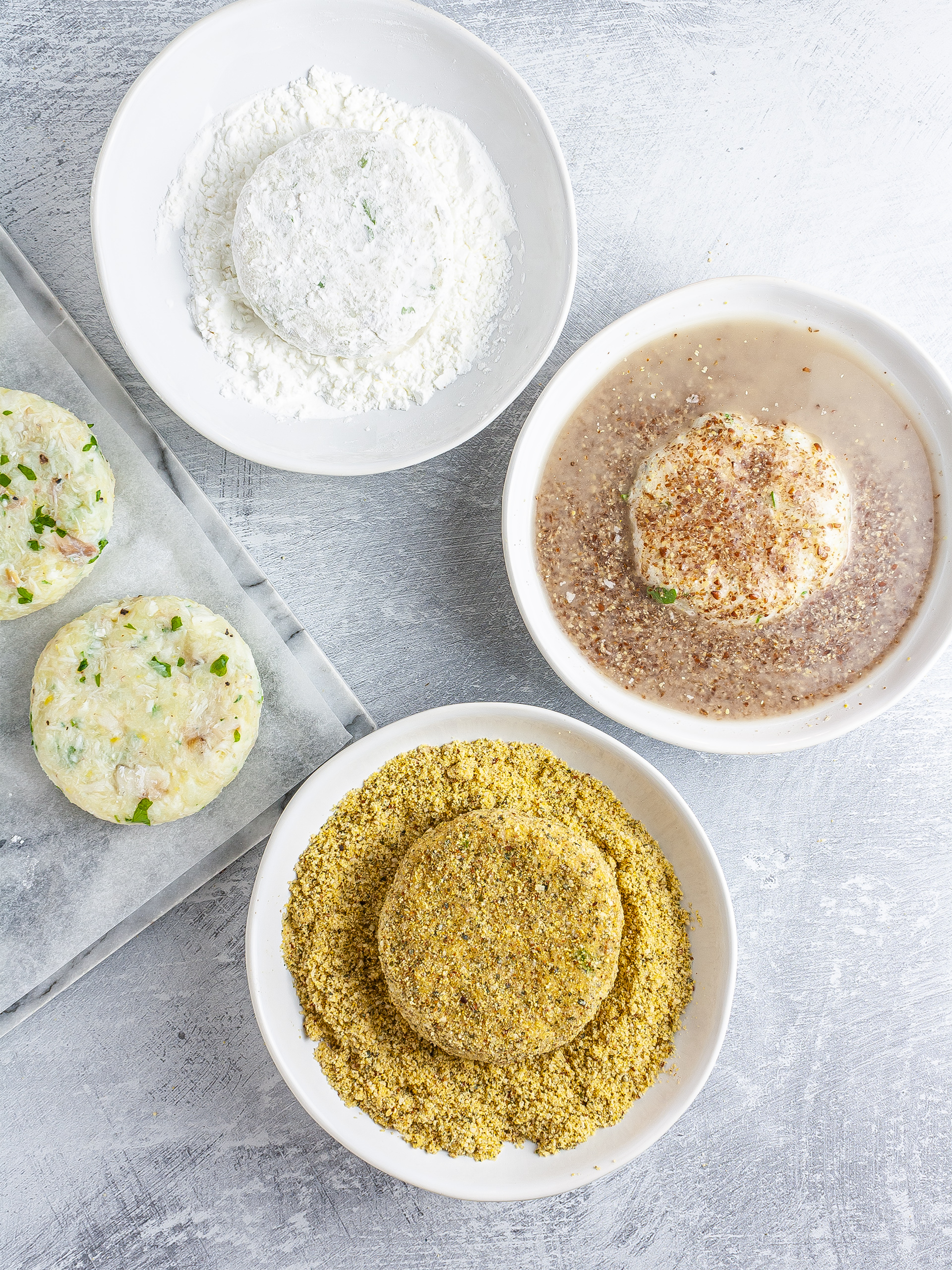 Fish cakes coated in starch, flaxseeds, cornmeal, and almonds