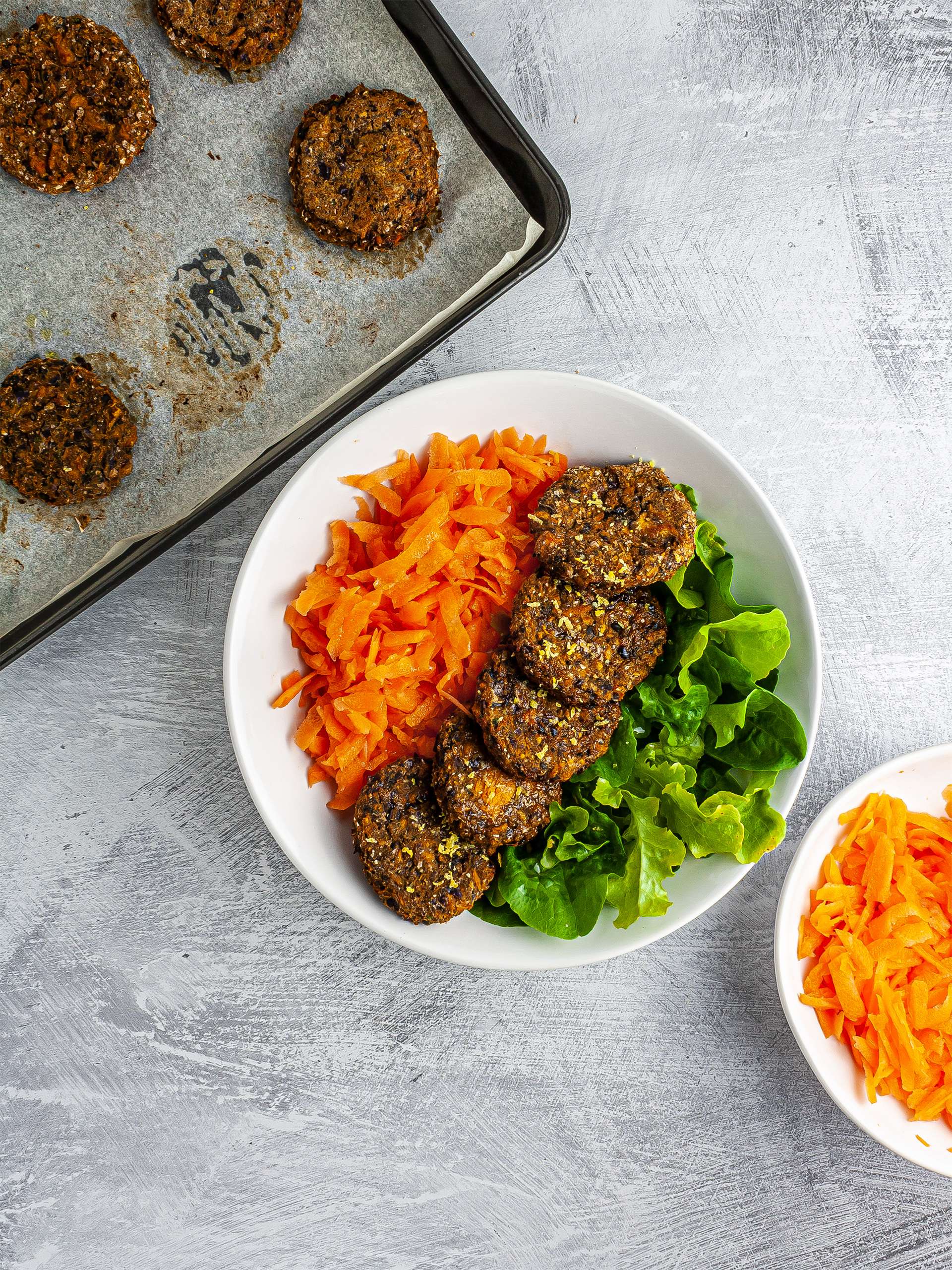 Baked falafels served with carrots and lettuce