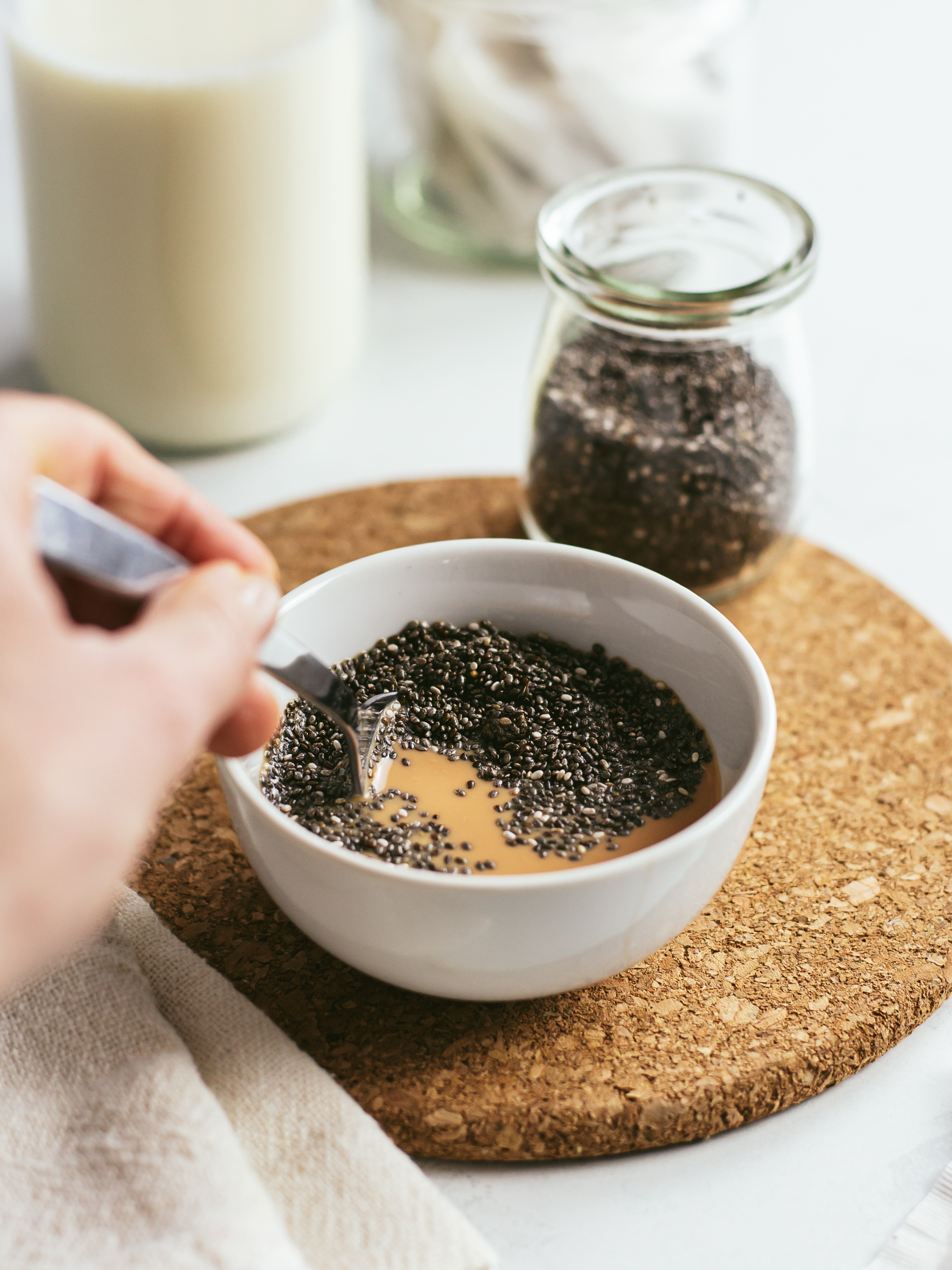 chia seeds stirred into chai milk tea