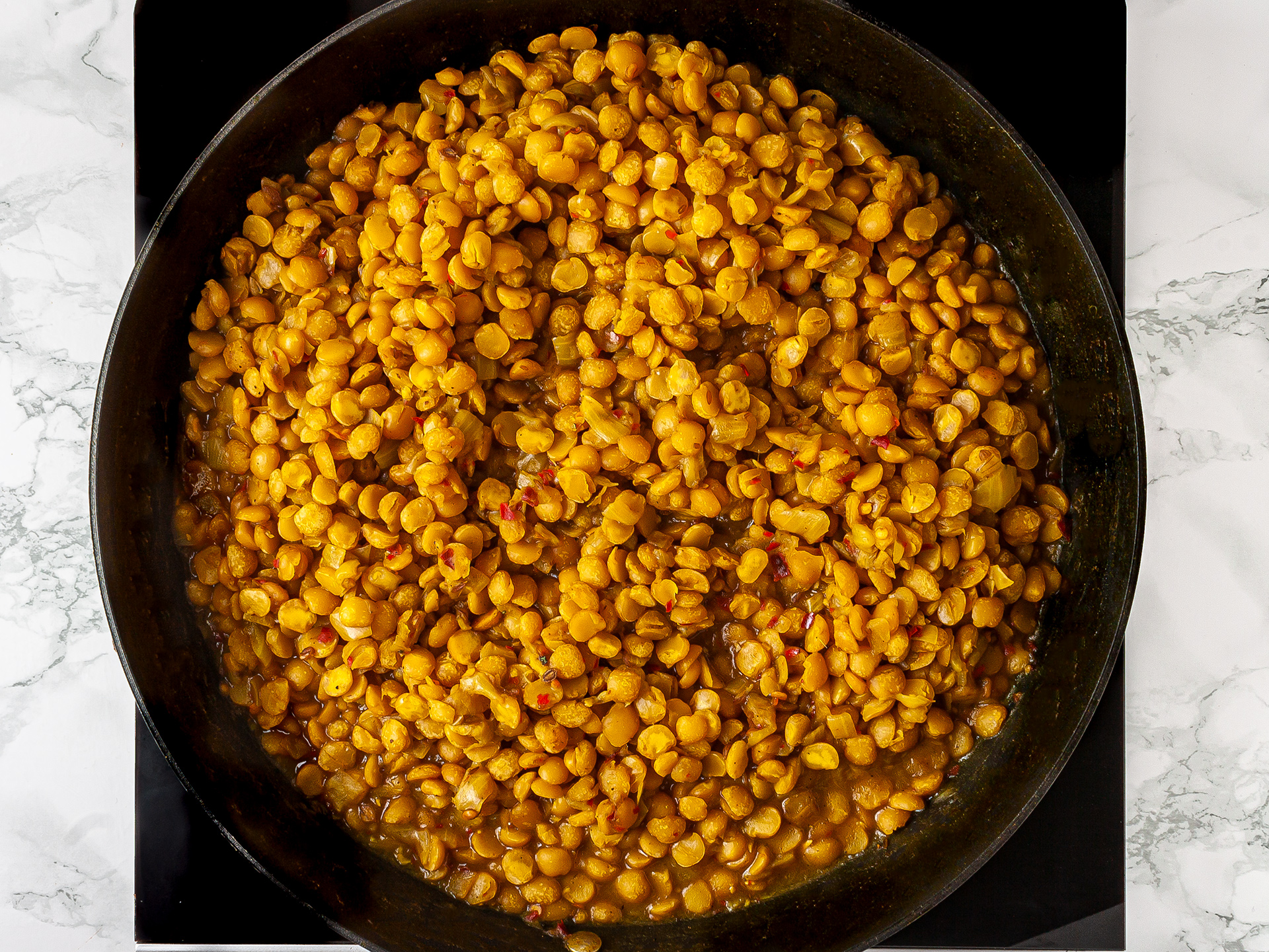 Ethiopian yellow split peas stew cooked in the pan.
