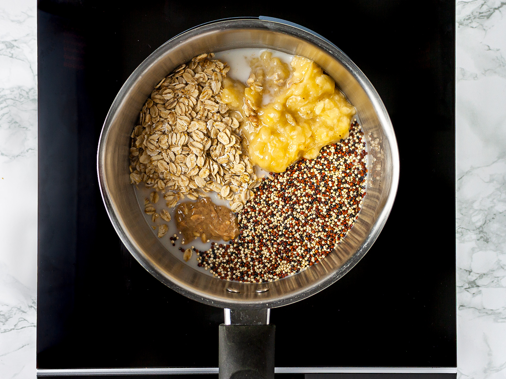 quinoa oats and banana cooking in a pot